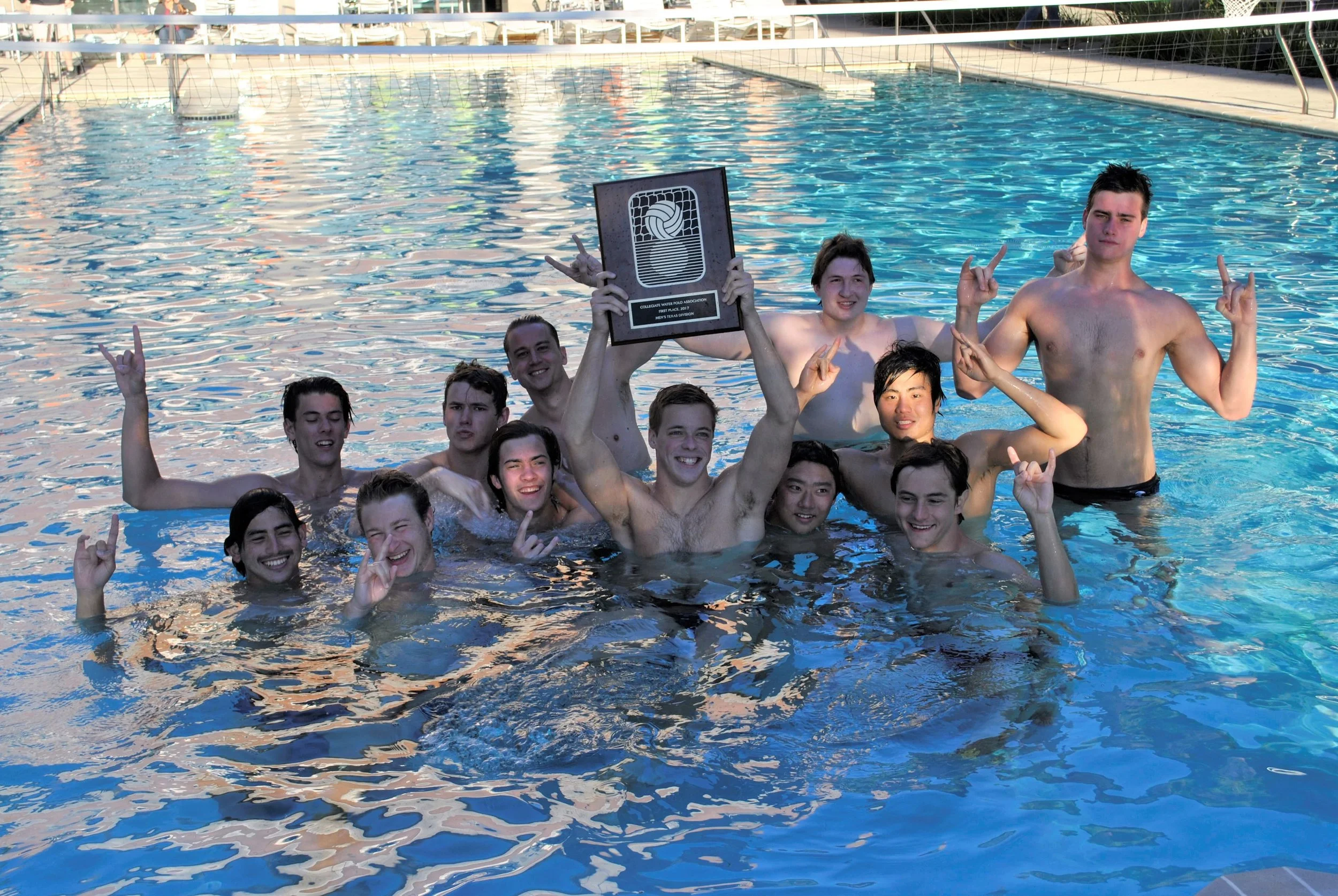 UT Men’s Water polo celebrates beating A&M and winning the regional championship. (Except Nate who looks a little confused)