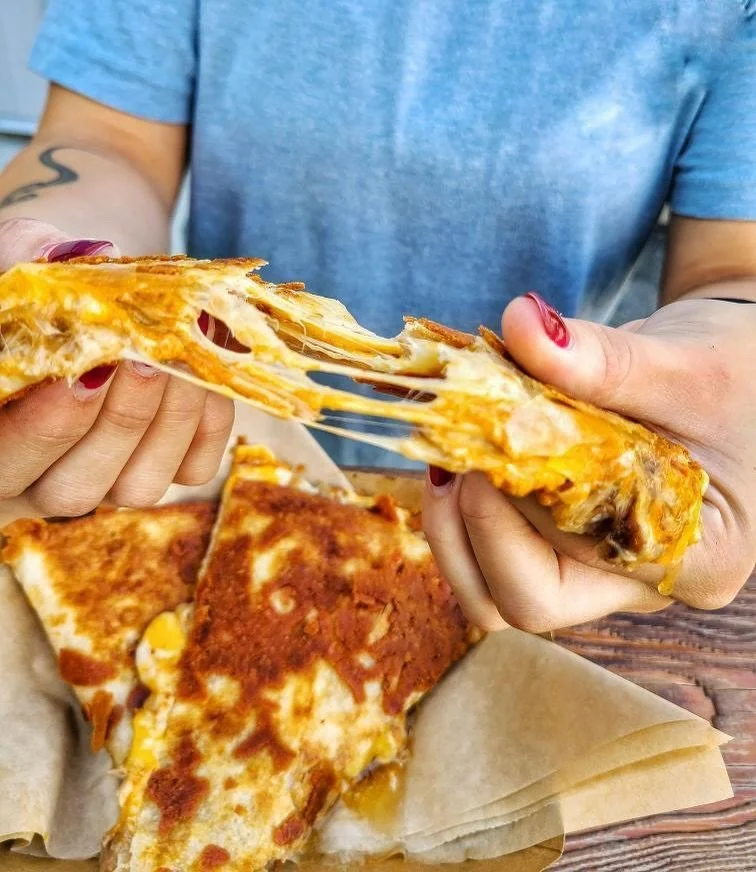Cheeeeeeese! 🧀 

Our Quesadillas are EPIC! Crispy griddled cheese on the outside, gooey melted cheese on the inside. Filled with your choice of protein and Chipotle Crema. Head on down for one of these and some Loaded Tots. 

🚐 @cg.mobilekitchen 

