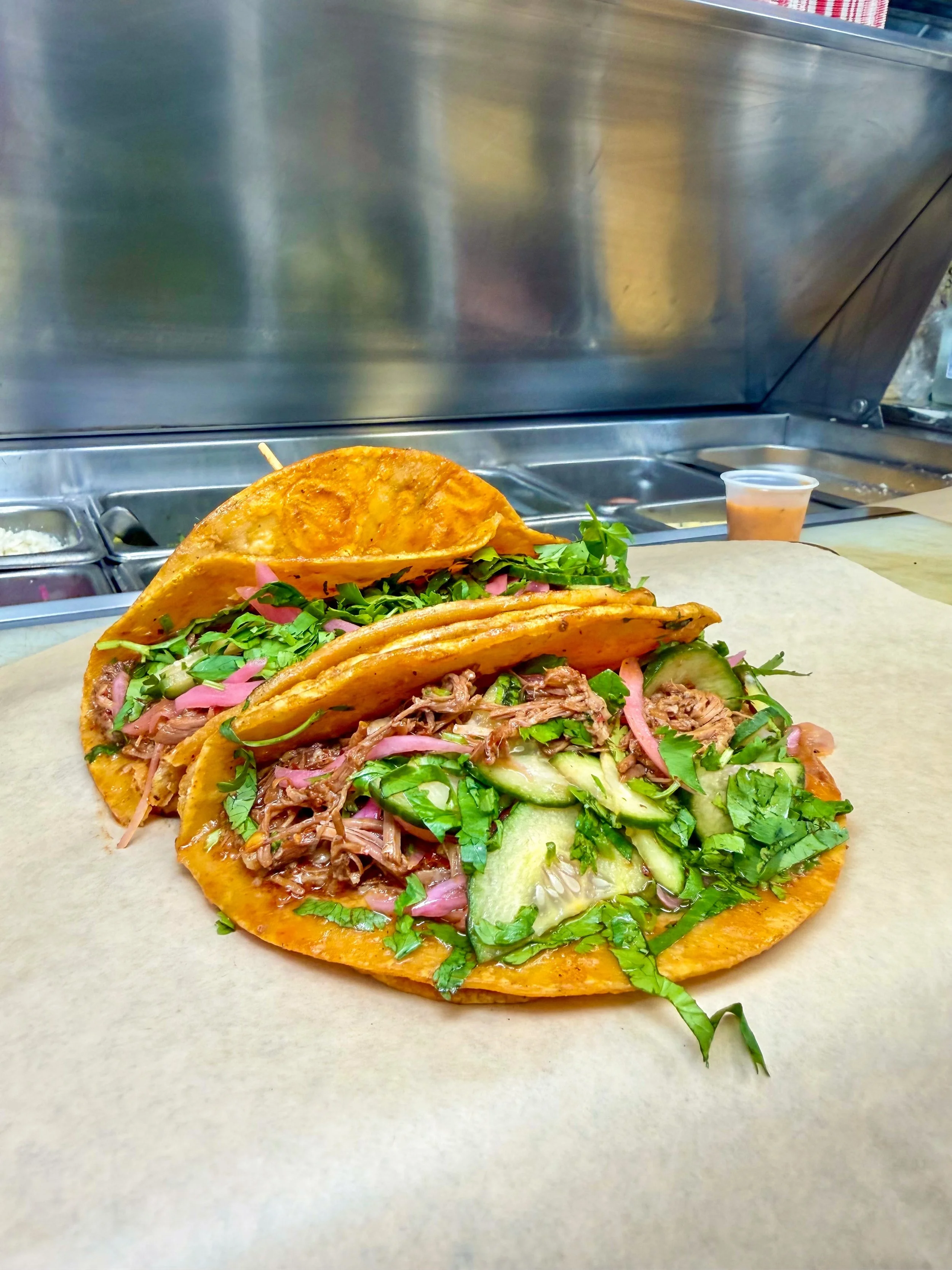 Our Slow-Braised Birria de Res is always juicy, tender and packed with flavor! Made with our signature blend of chilies and spices, our Birria is perfect on Tacos, Loaded Tots, Quesadillas and our Pa&rsquo; M&iacute; Sandwich. Hit the link in our bio