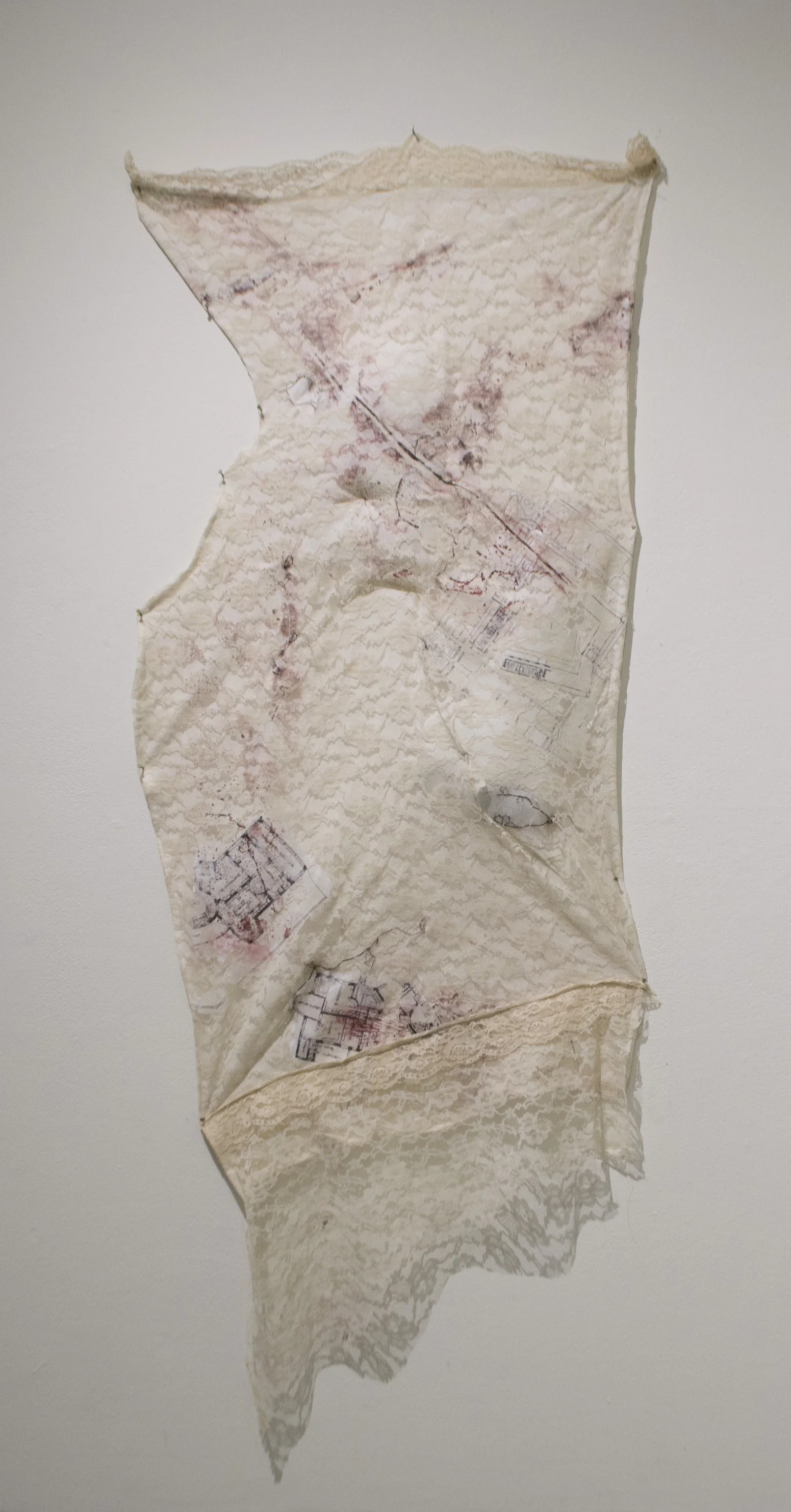 The body bisected Lace, collograph, gel transfers, embroidered human hair, polyfill 2017