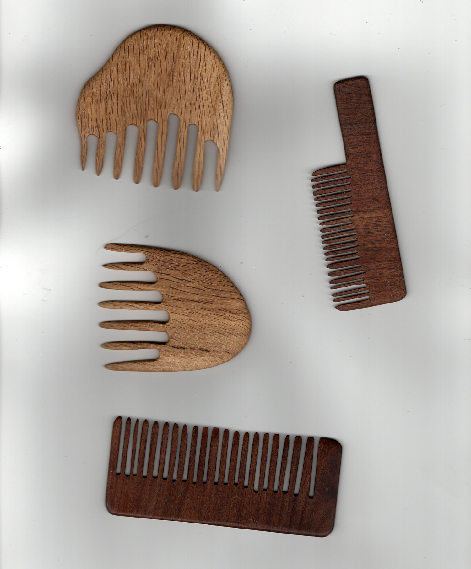  Combs 1-4  Oak wood, walnut wood, hand crafted combs  2020   This project was made possible by funding from the Minnesota State Arts Board through an Artist Initiative Grant in 2020 