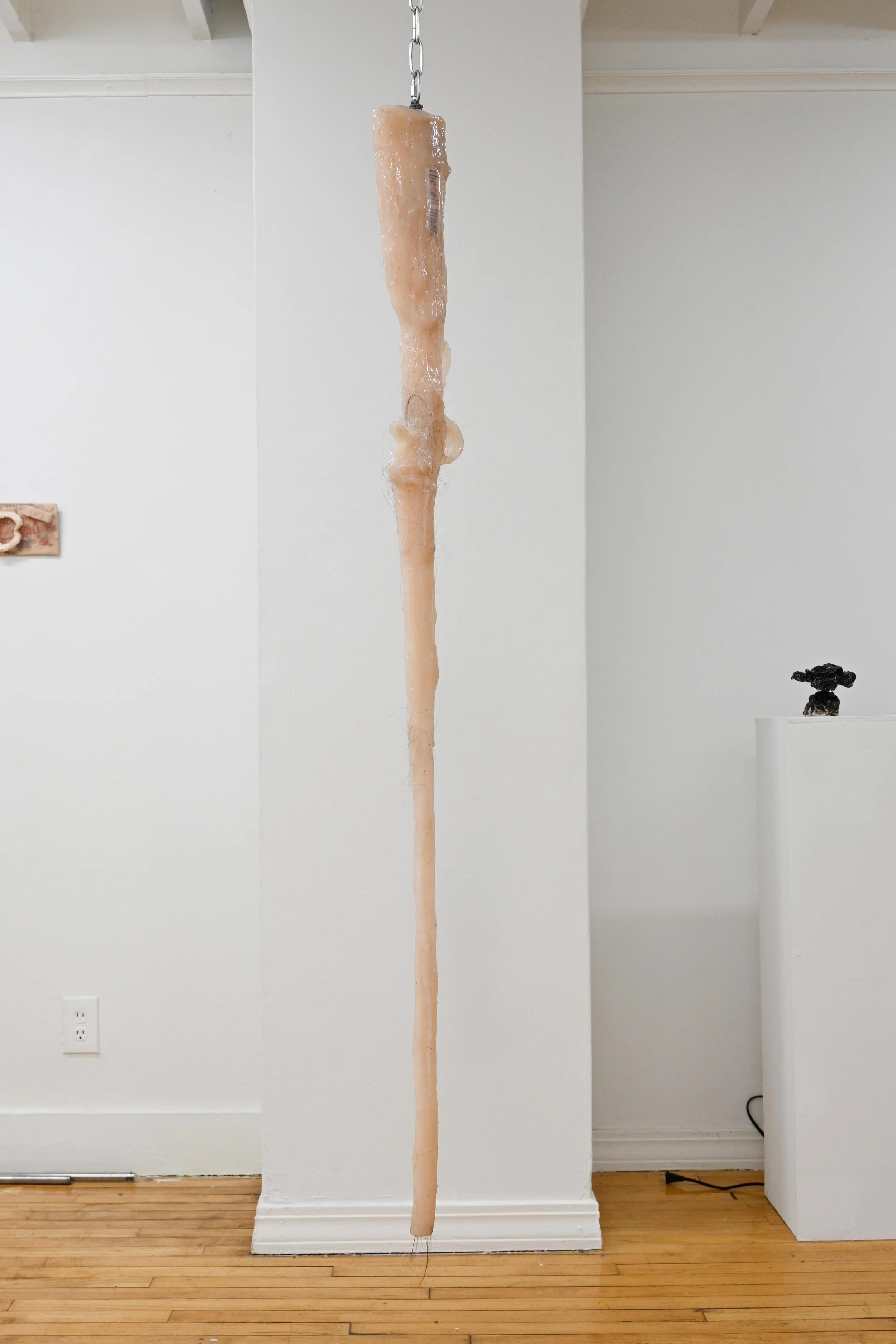 Another body lowered to the ever grateful earth, 2024 Cast silicone, tattooed silicone, human hair From solo exhibition Sallow at Hair and Nails Gallery, Minneapolis 2024 Photographed by Emma Beatrez