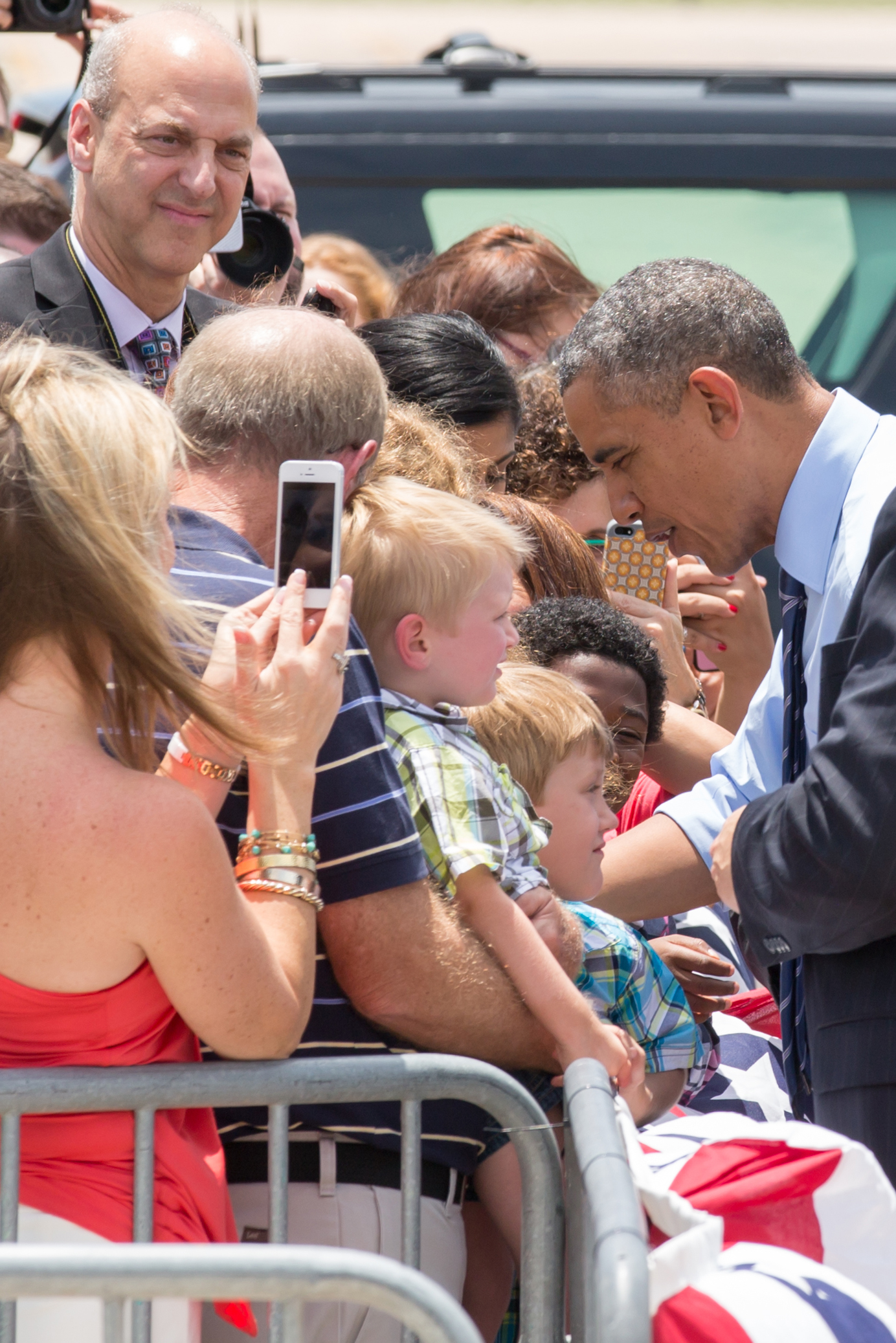 President Barack Obama signs autographs before entering Air Force One in Austin, TX in 2015.