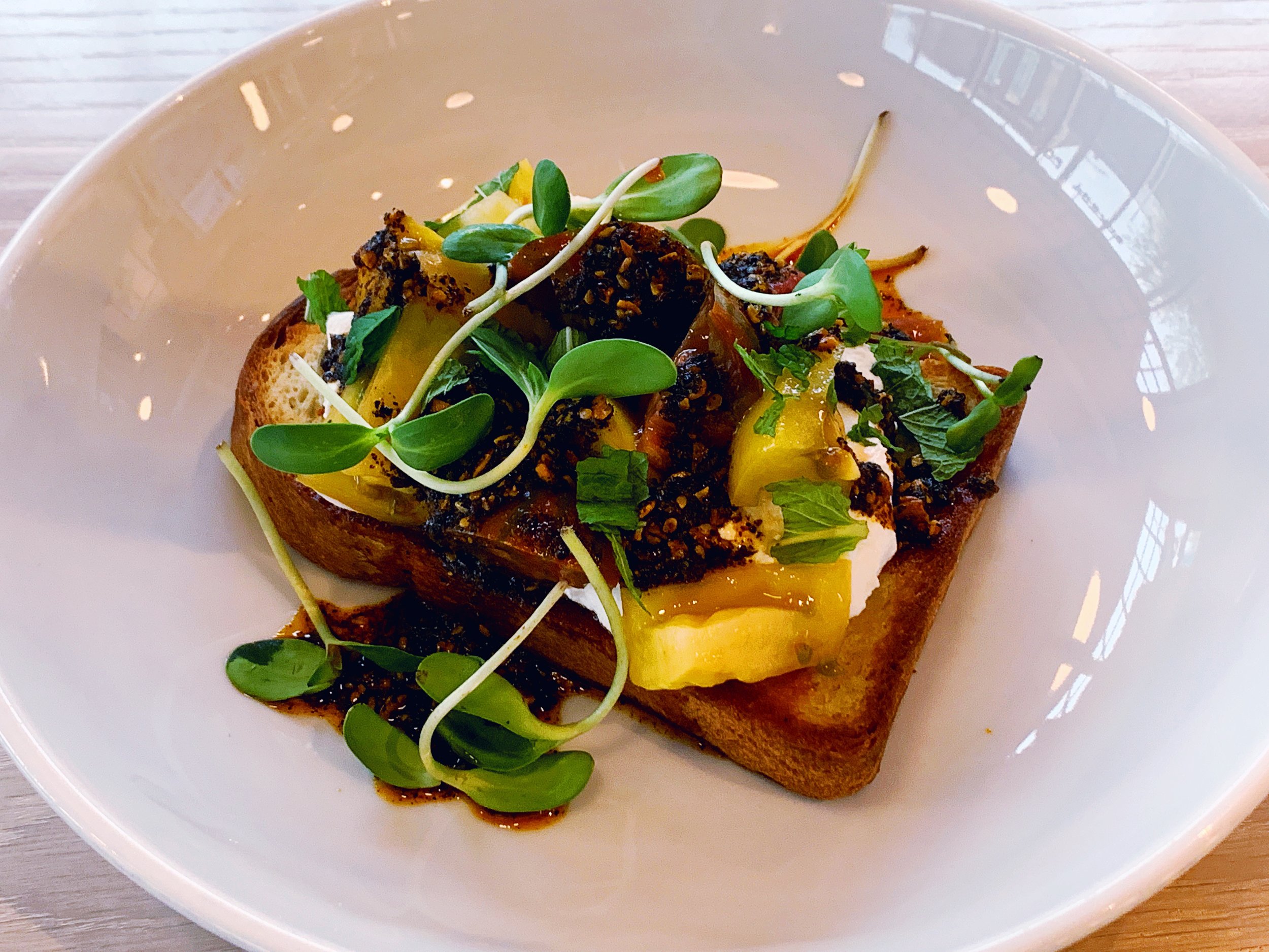 This Tomato Toast is to die for! I highly recommend that you don’t share it. It’s worth an adventurous bite, or two, or three. :)