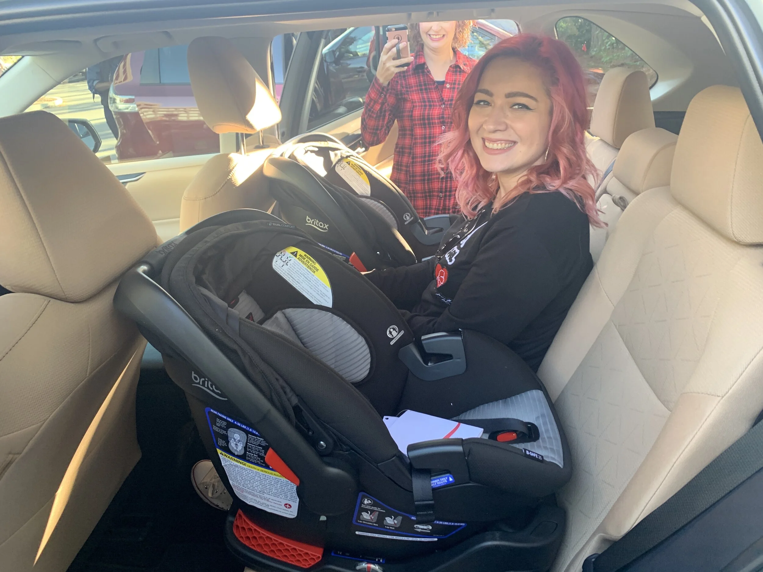 Monica got in between two car seats, too, and we were amazed at how every SUV or Truck had different amounts of space in that middle seat.
