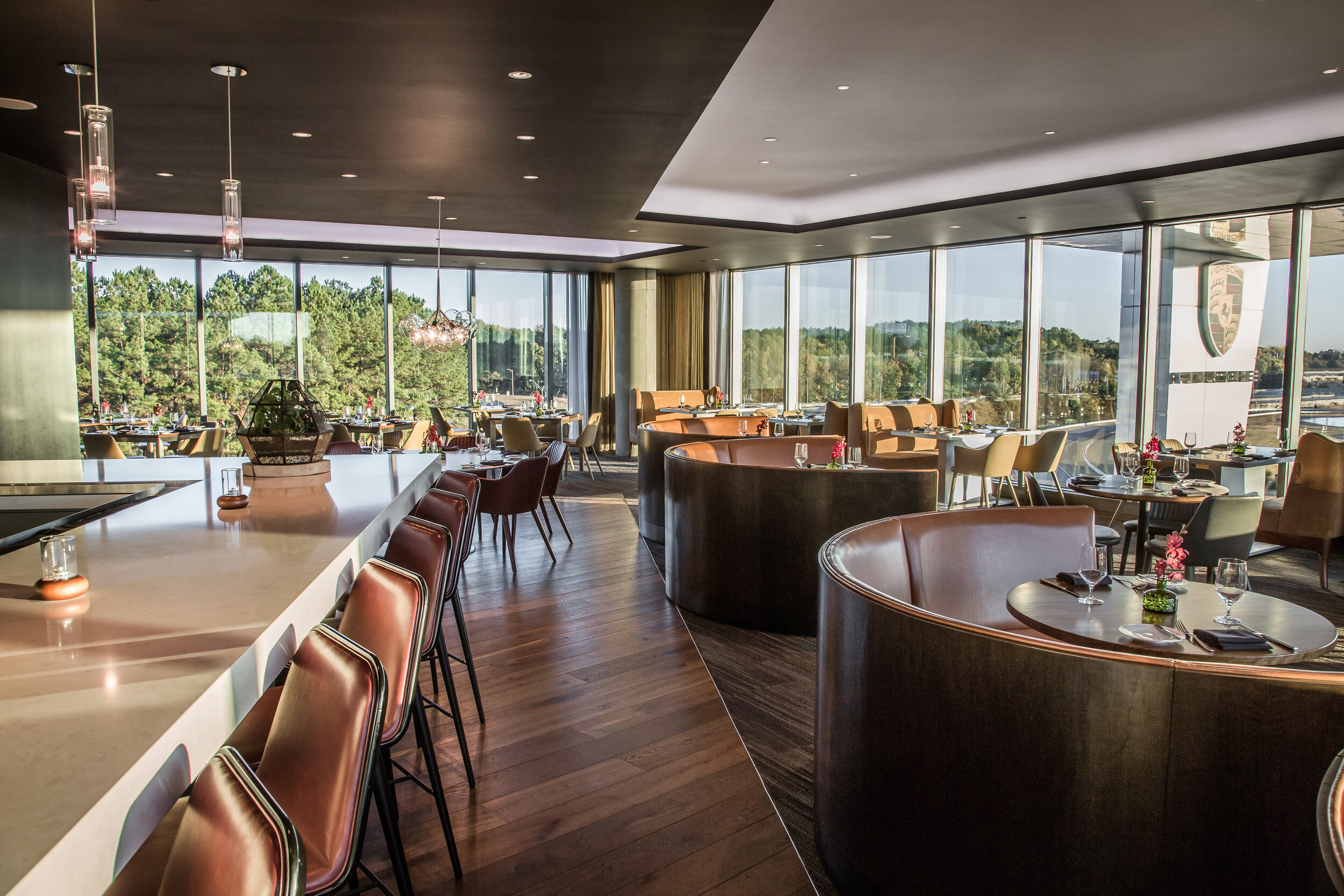 Dining with a view of the track and the planes while they take off from the Atlanta Airport. It’s decadence that matches the iconic Porsche brand. Photo Credit: Porsche