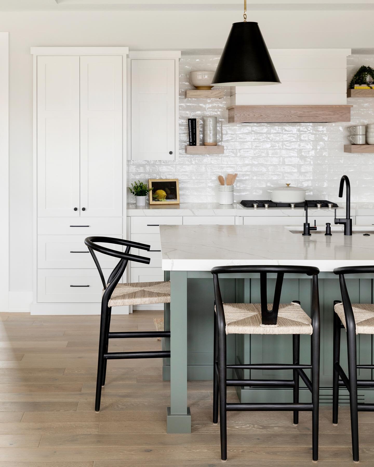 Green with envy? This green island accents and softens a stunning kitchen.