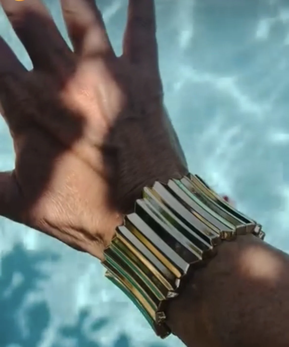 gold ribbed bangle pool.jpg