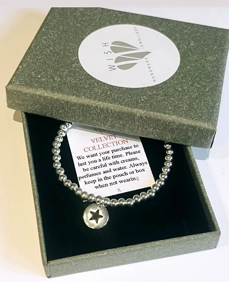 STERLING SILVER STAR DISC BRACELET