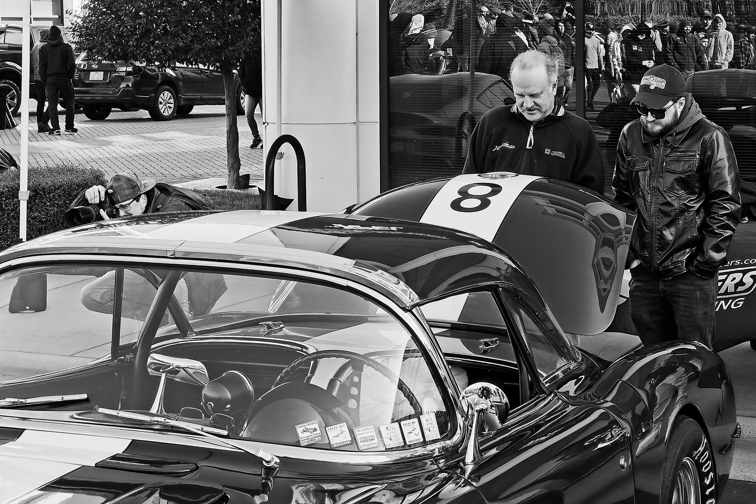  image from a car show in Charlotte, NC - two men looking into the trunk of a vintage Corvette 