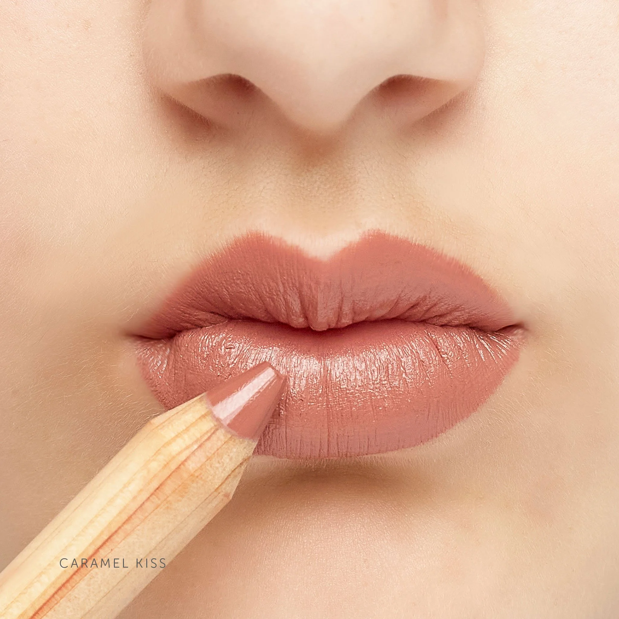 LÜK_LipstickCrayon_Caramel Kiss_OnLipswithPencil_ShadeName.jpg