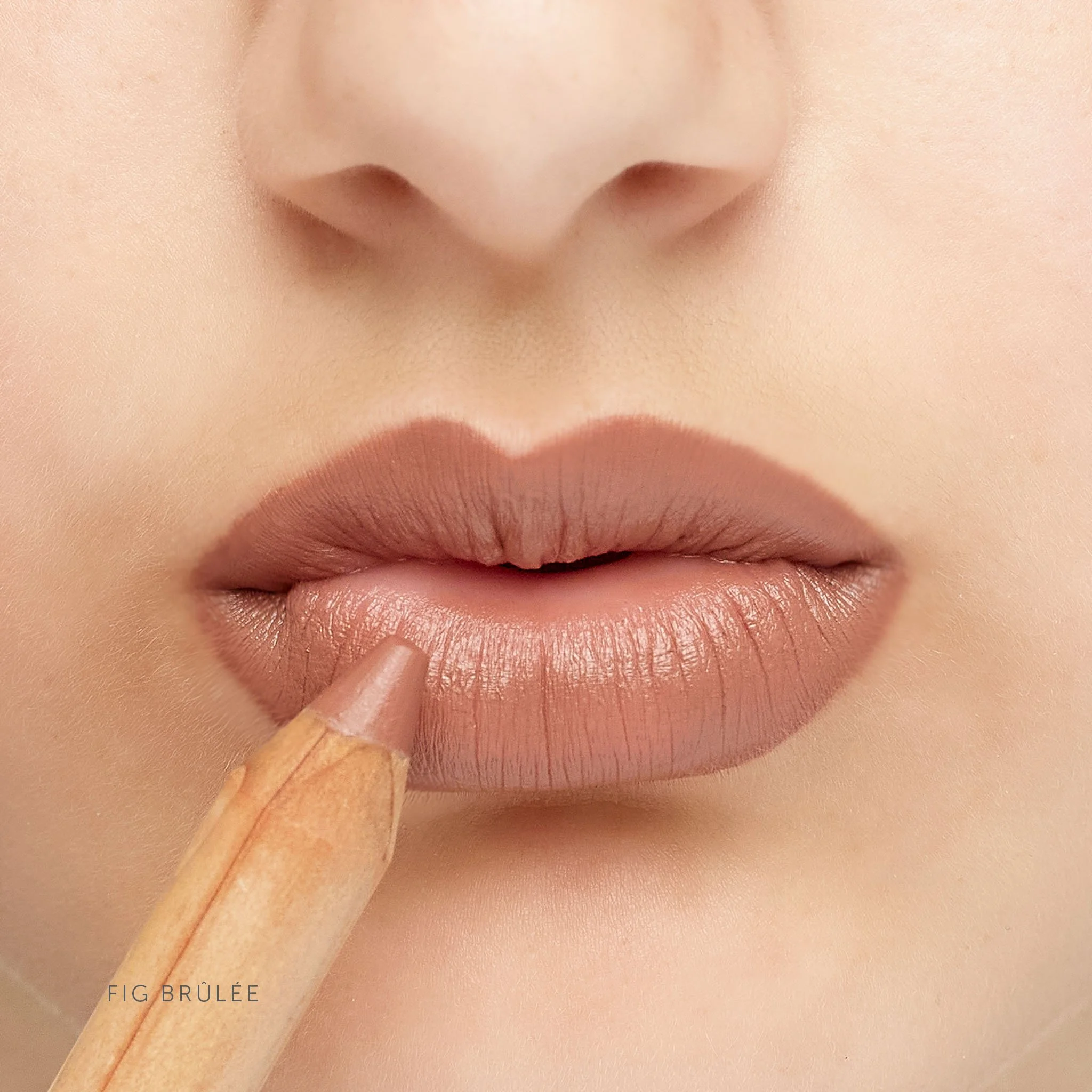 LÜK_LipstickCrayon_Fig Brûlée_OnLipswithPencil_ShadeName.jpg