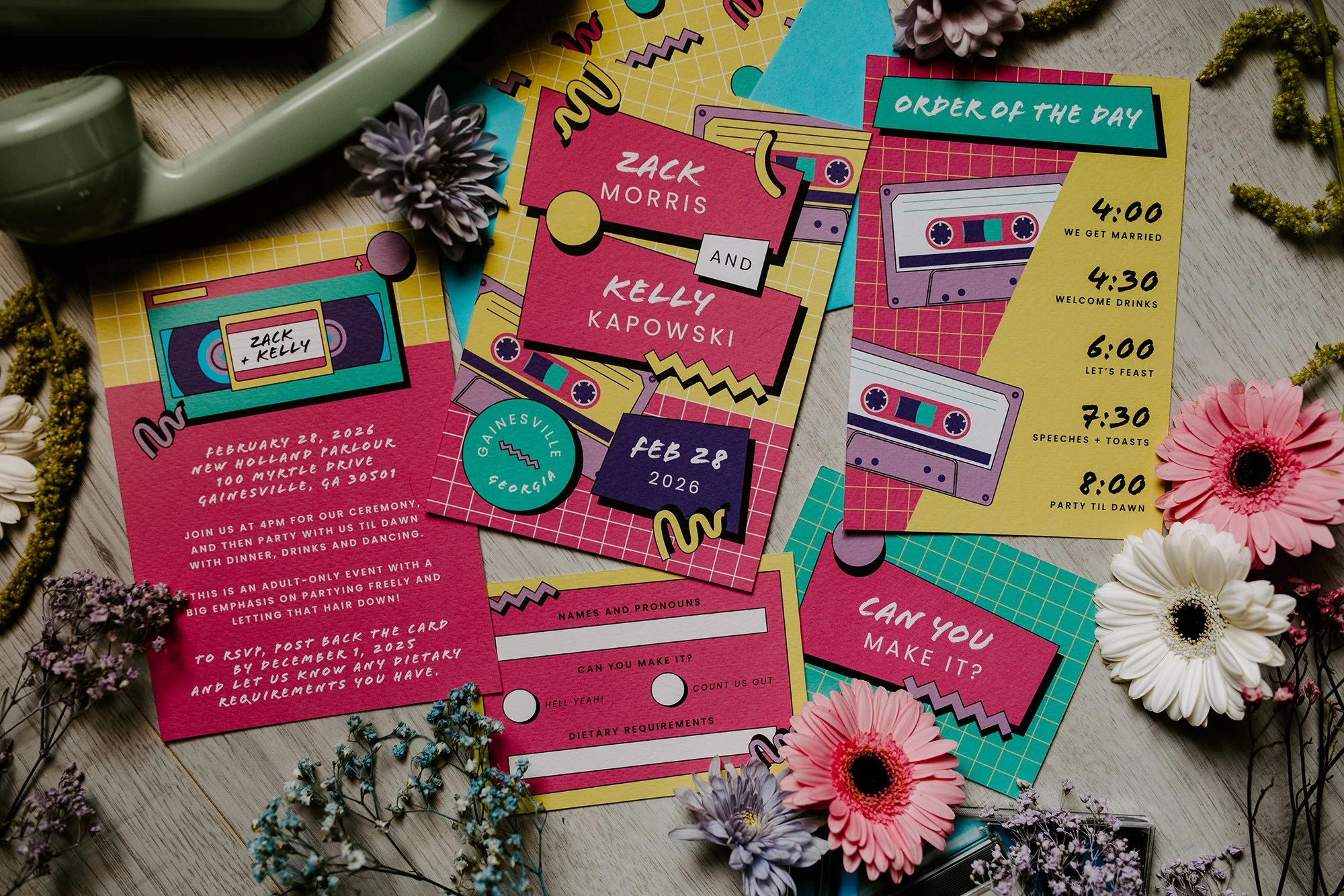 Saved By the Bell themed wedding stationery including VHS tapes, cassette tapes and graphic shapes.