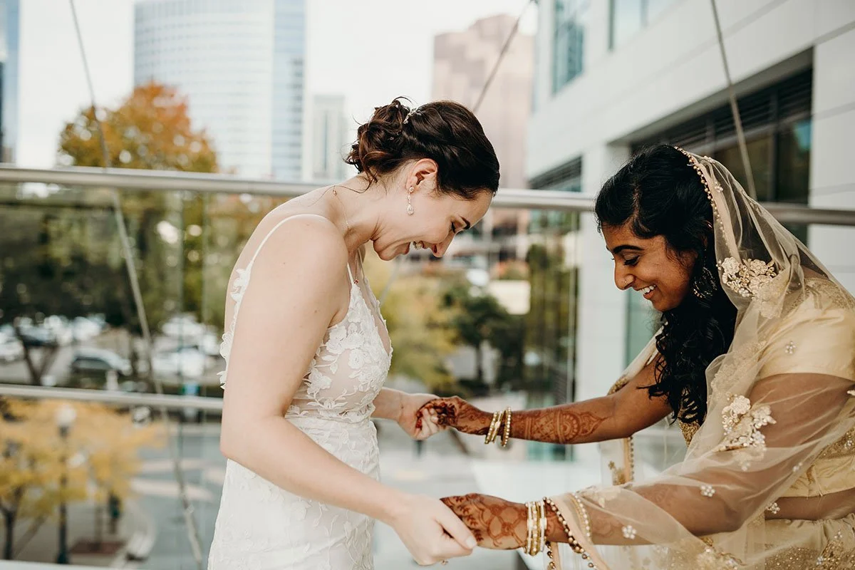 ch other for the first time. They smile widely, hold hands and react in wonder at each other's wedding outfits.