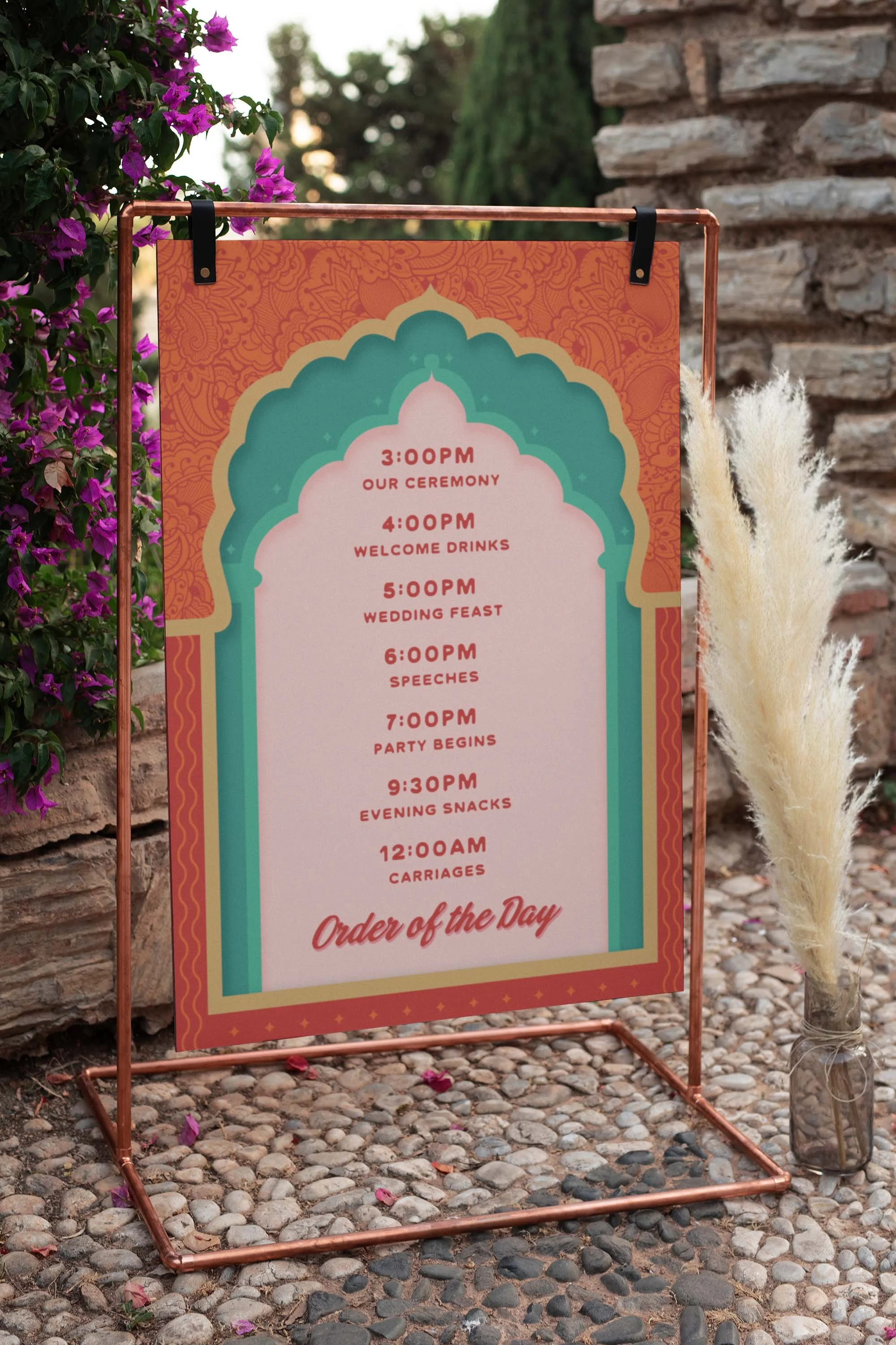 An Indian wedding sign with the order of the day with mandala arches.