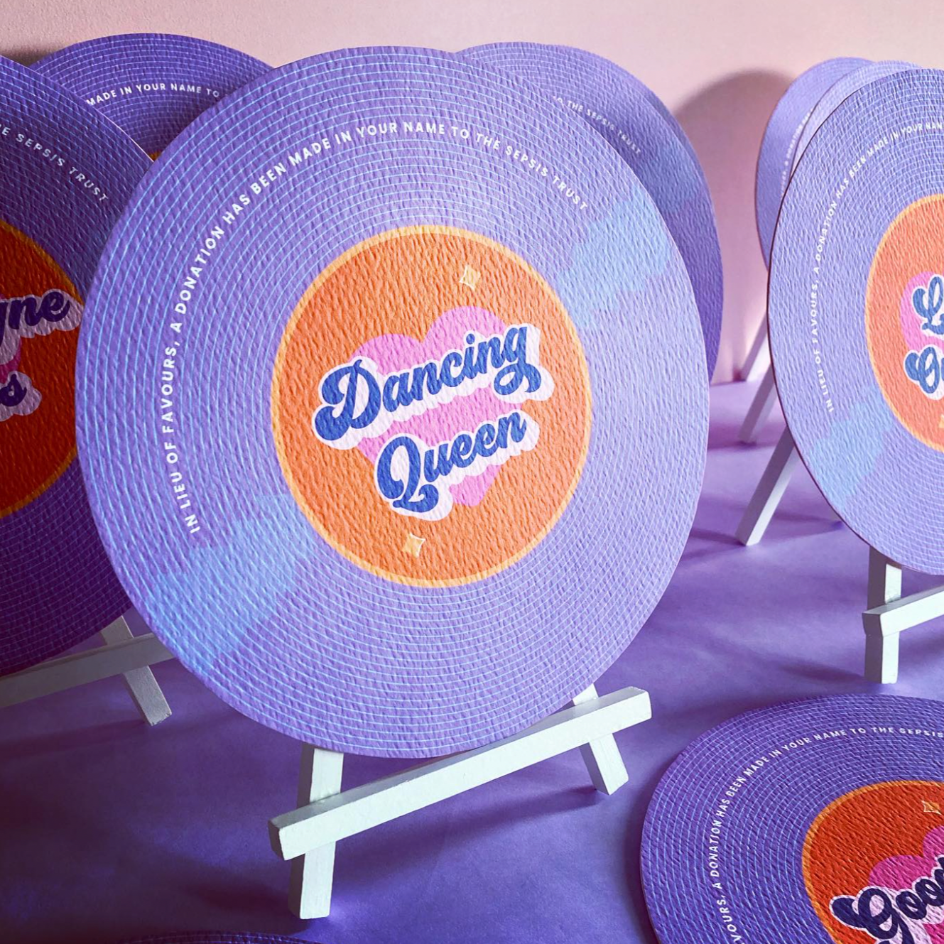 Vinyl-recored style table names with song names on each.