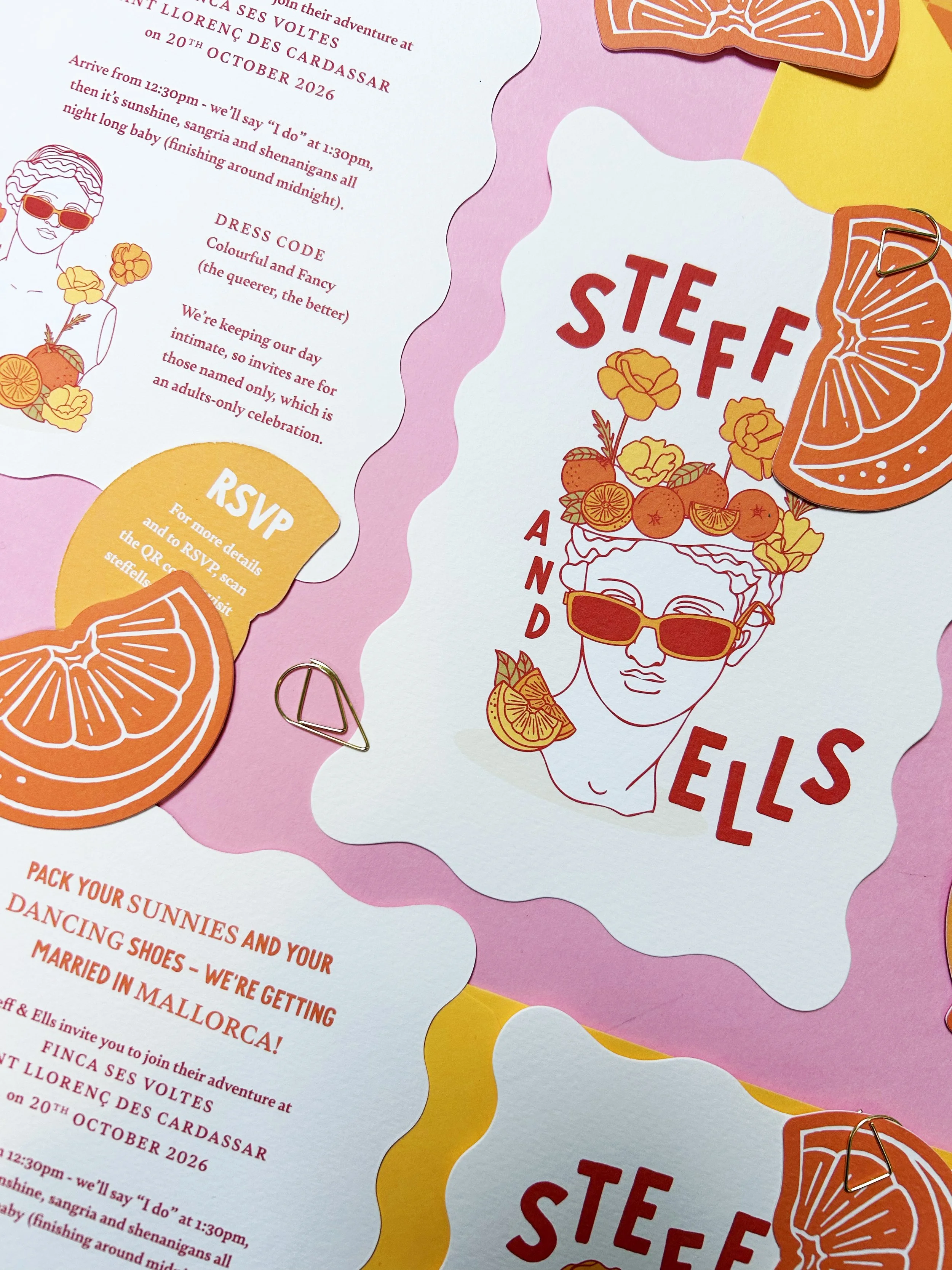 Wavy-edged wedding invitations with RSVP cards shaped like orange segments.