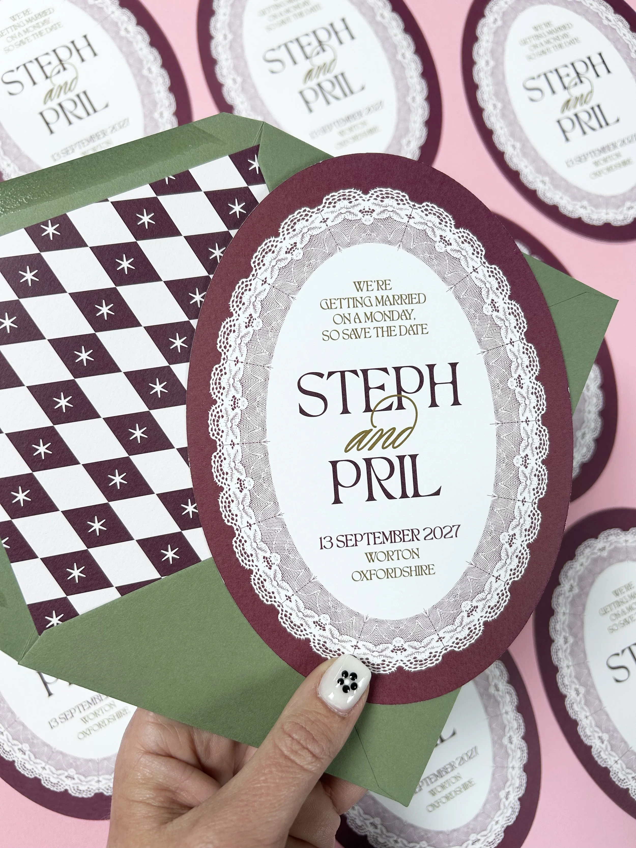 Oval save the dates in burgundy and olive green.