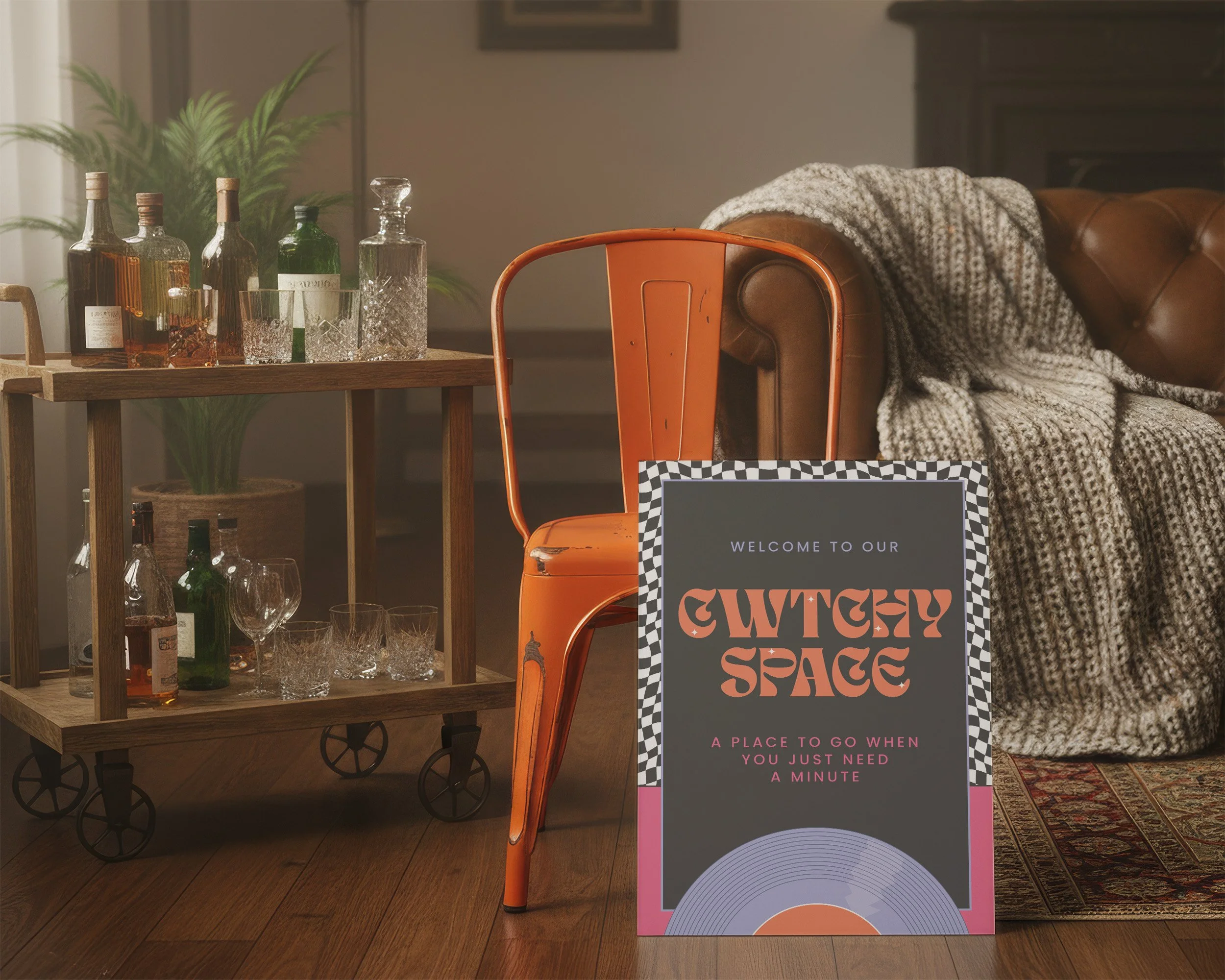 A cosy space with sofa and cocktail card, with a sign saying 'Cwtchy space for when you need a minute'.