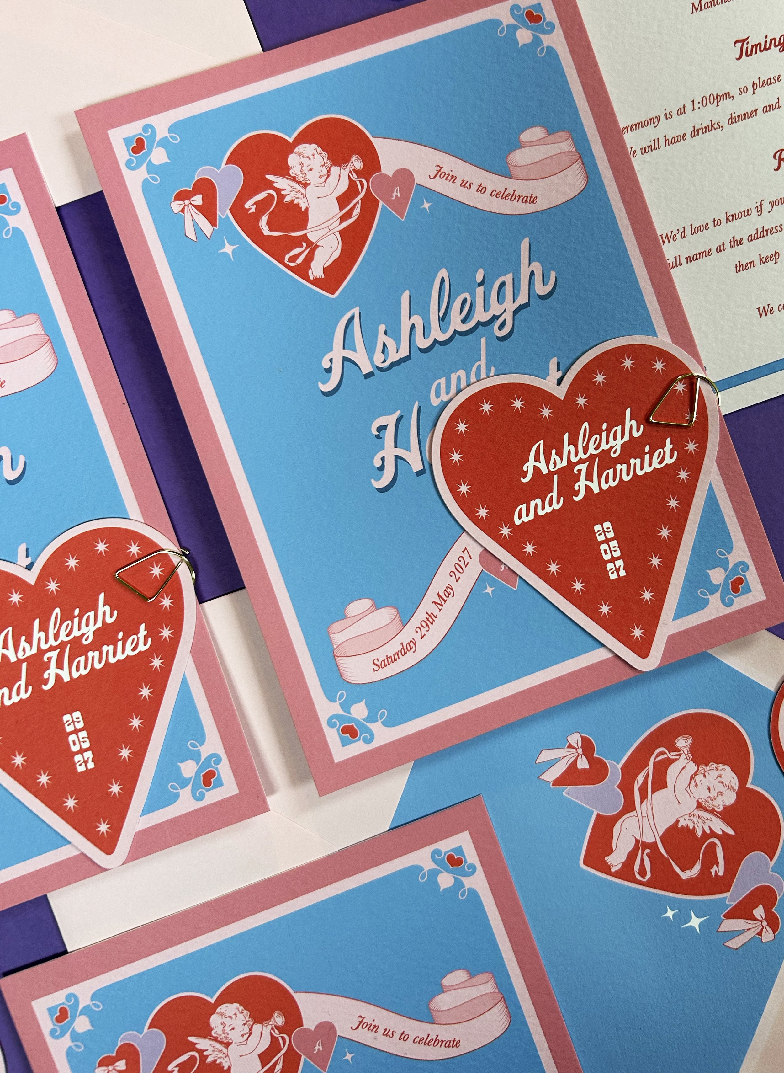 Vegas-inspired wedding invites with cupids and hearts.