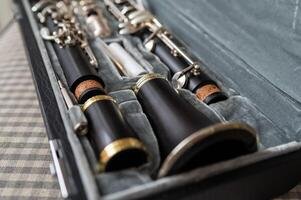 a-black-clarinet-rests-in-an-open-case-with-a-plush-interior-photo.jpg