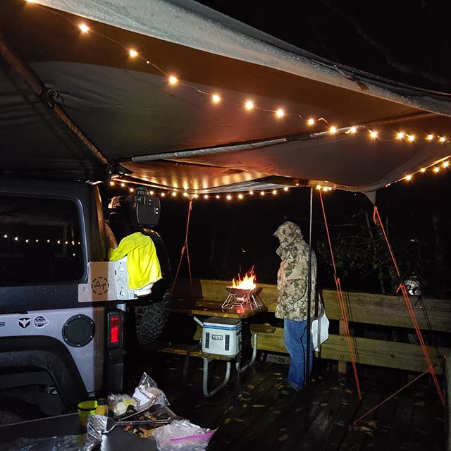 Overland Power Solutions....little were weather camping at Edgar Evins State Park. Staying bone-dry under the Rhino Rack Compact Batwing 270 degree awning . Grilling some off-the farm Jalepeno Sausages and little bit of whiskey with @otflyguy ! Light