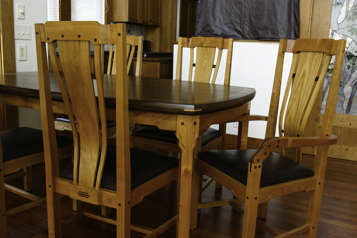  Dining table and chairs -  Cherry and Wenge,  carved accents, individually fitted lumbar support backs 