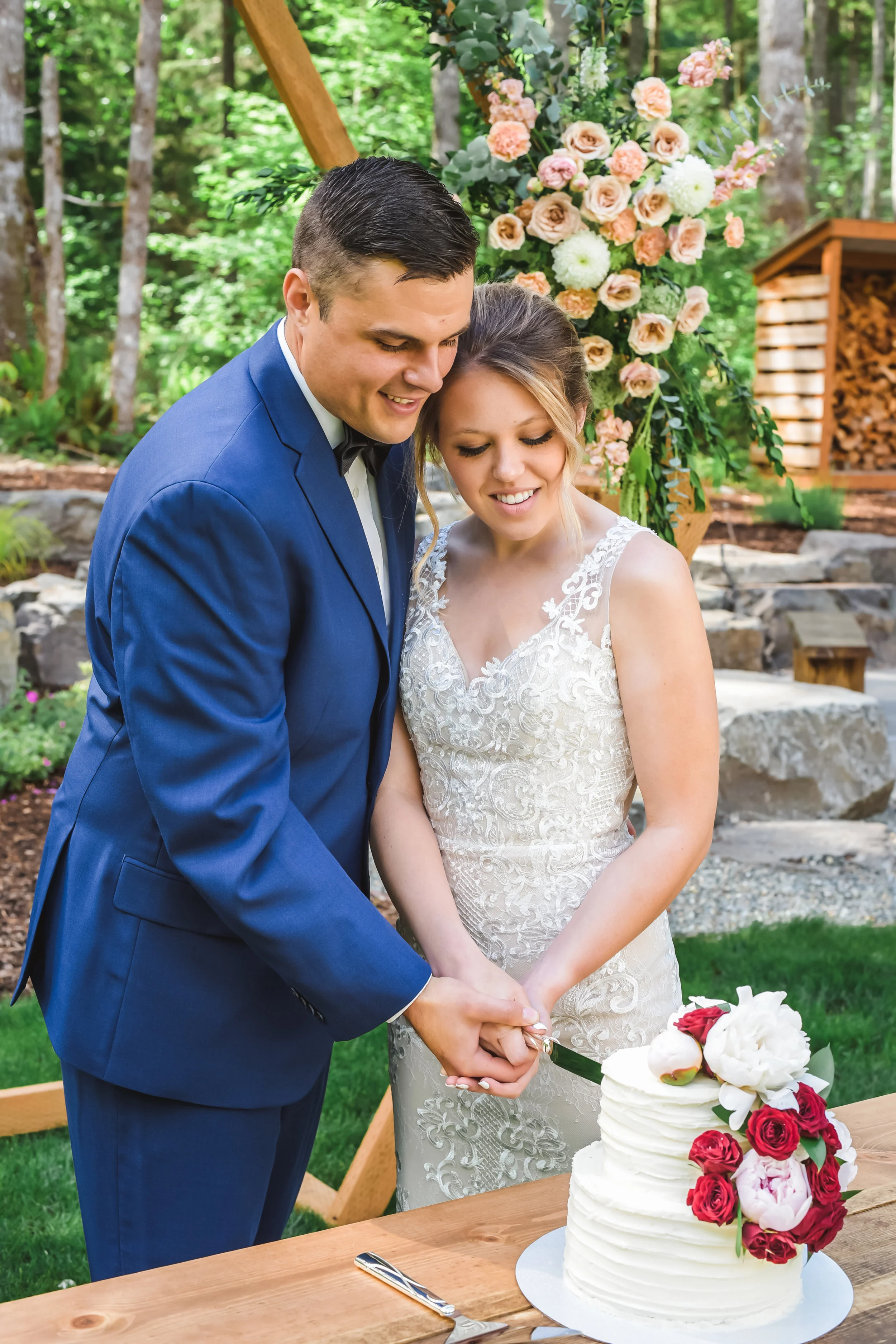 Bride and groom cutting cake