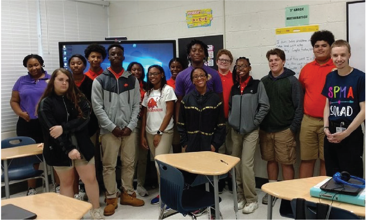 Students of Conecuh Country Schools proudly stand with their new CenterStage Interactive Display and Pilot 3 Digital Podium