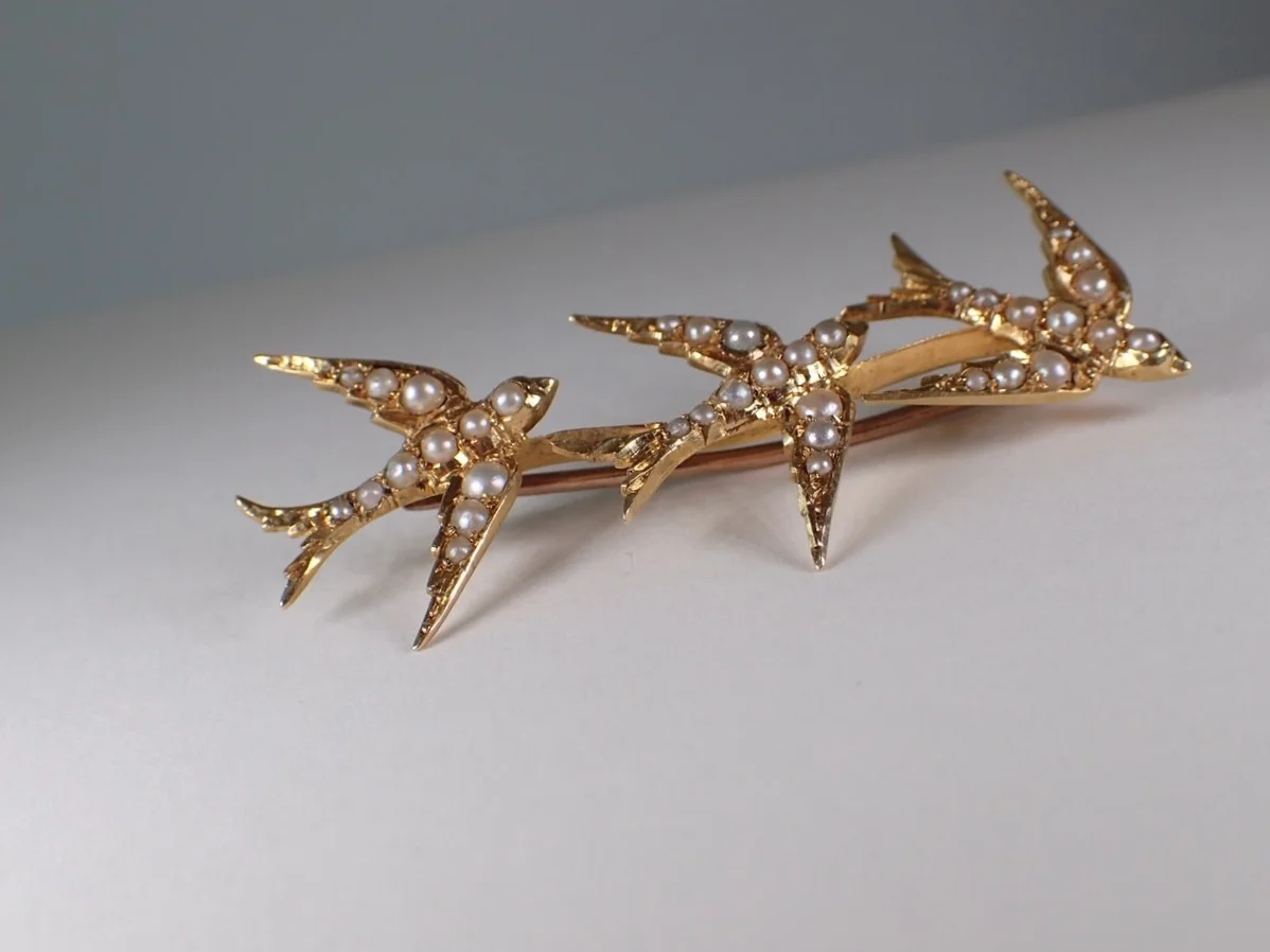 Antique swallow brooch