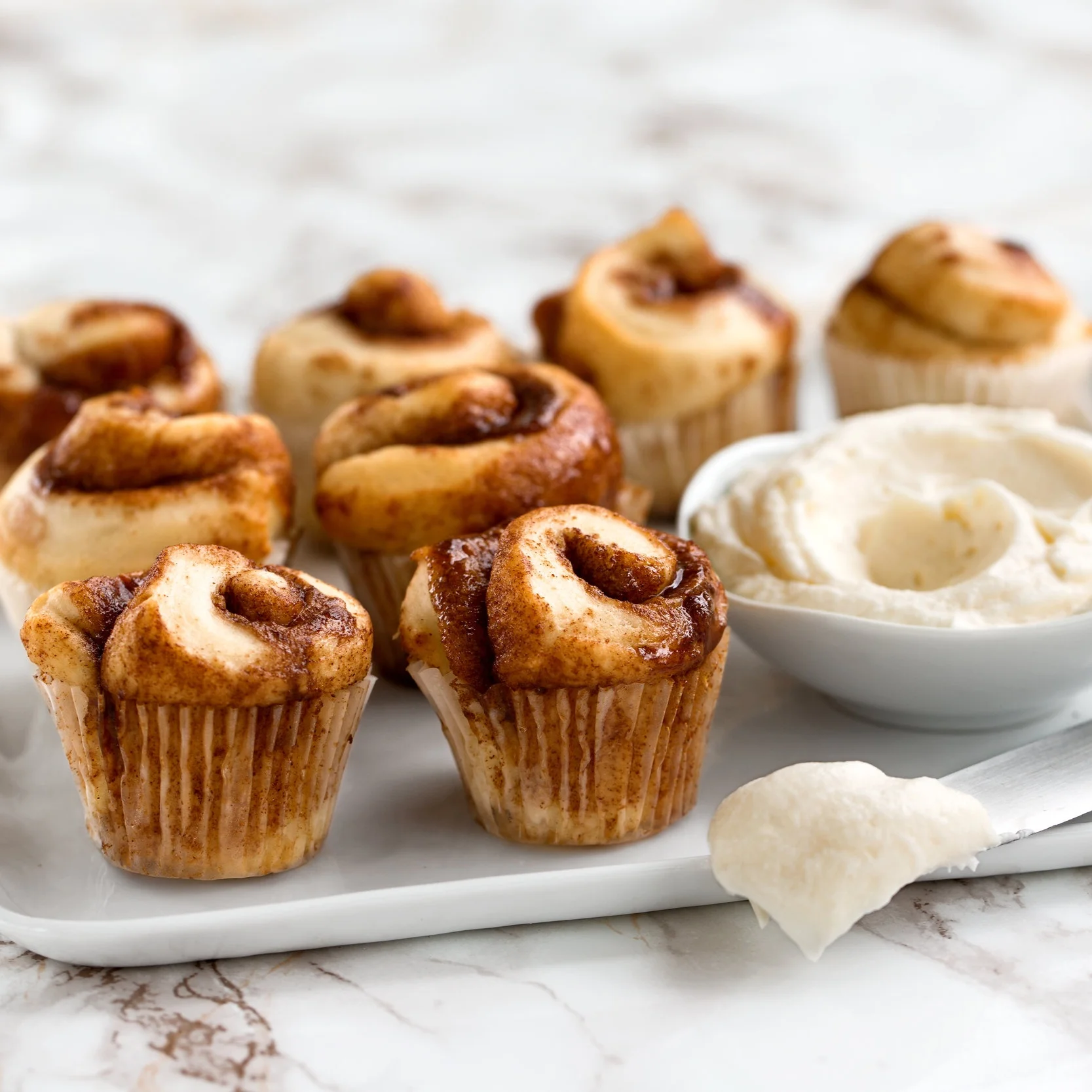 Bite-sized Baby Buns Sold in qualities of 3, 6, or 12. Served plain or frosted with one topping.