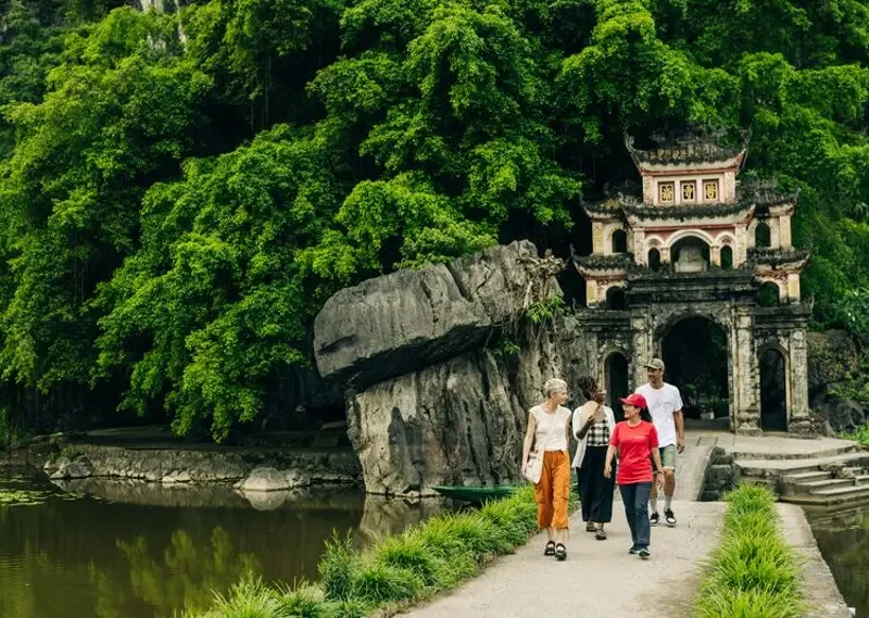 Intrepid-Travel-Intrepid_Vietnam23_Ninh-BInh-walking-group-leader_agp_0767.webp