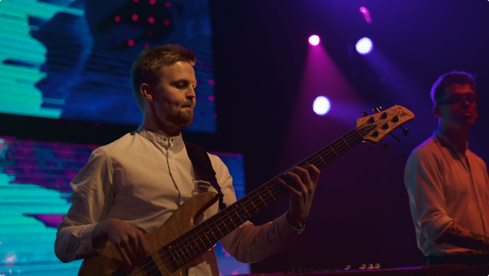 The Live Notes 10-piece band on stage at a corporate event