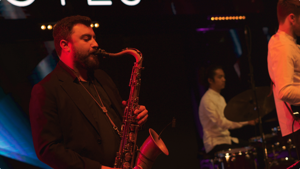 The Live Notes sax player on stage