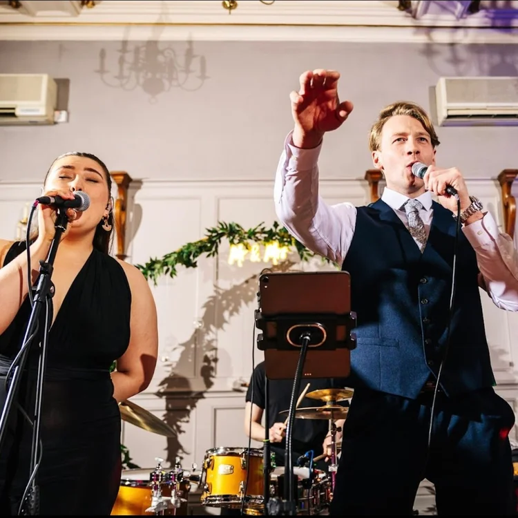 Two Live Notes vocalists performing at a wedding