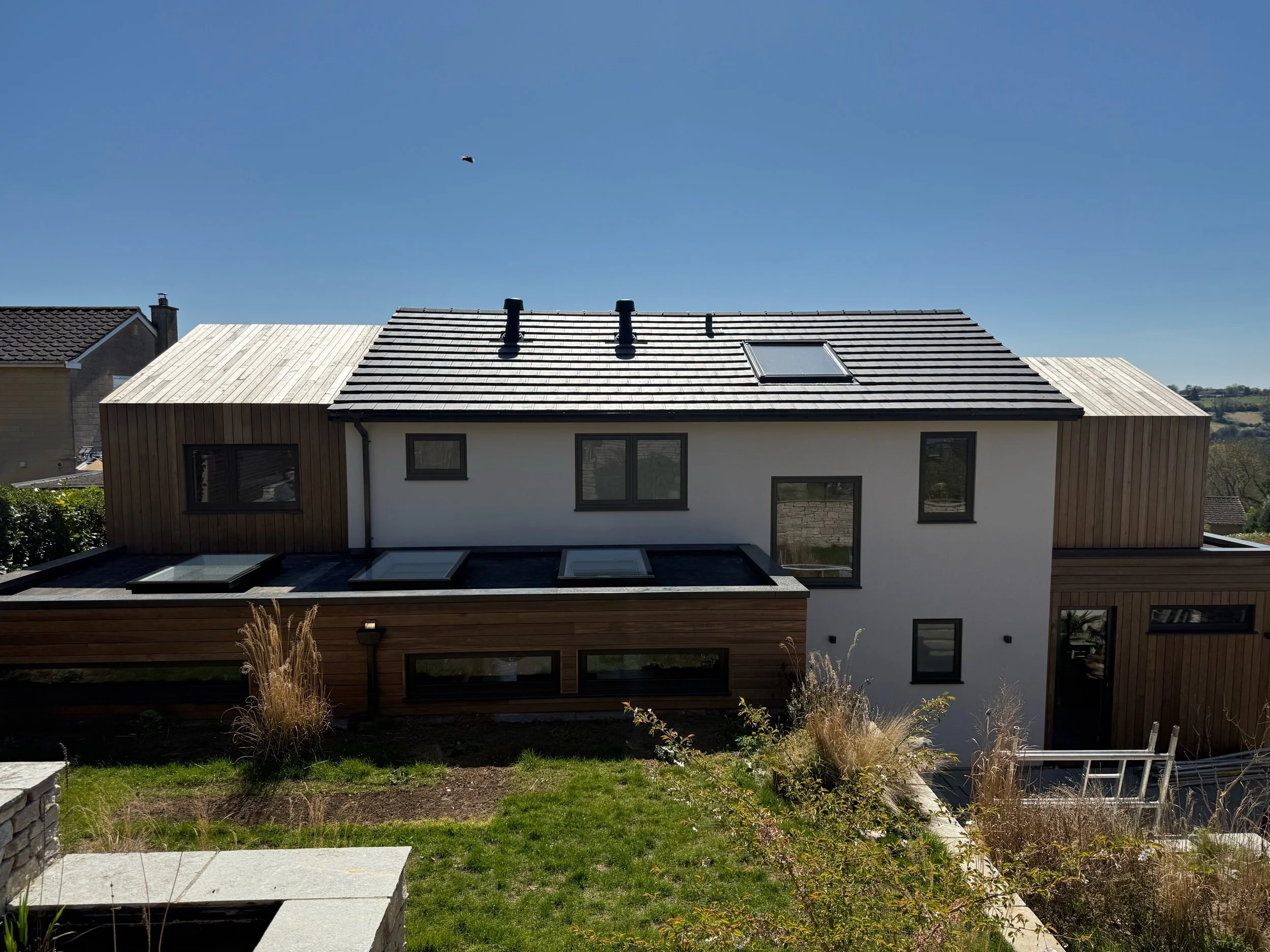 Cladding and rendered extension 