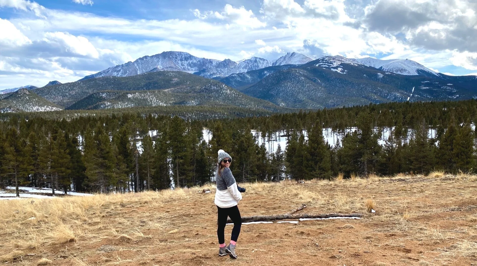 I love to travel and photograph the world around me. Here’s a photo of me taken while at Pikes Peak in Colorado.