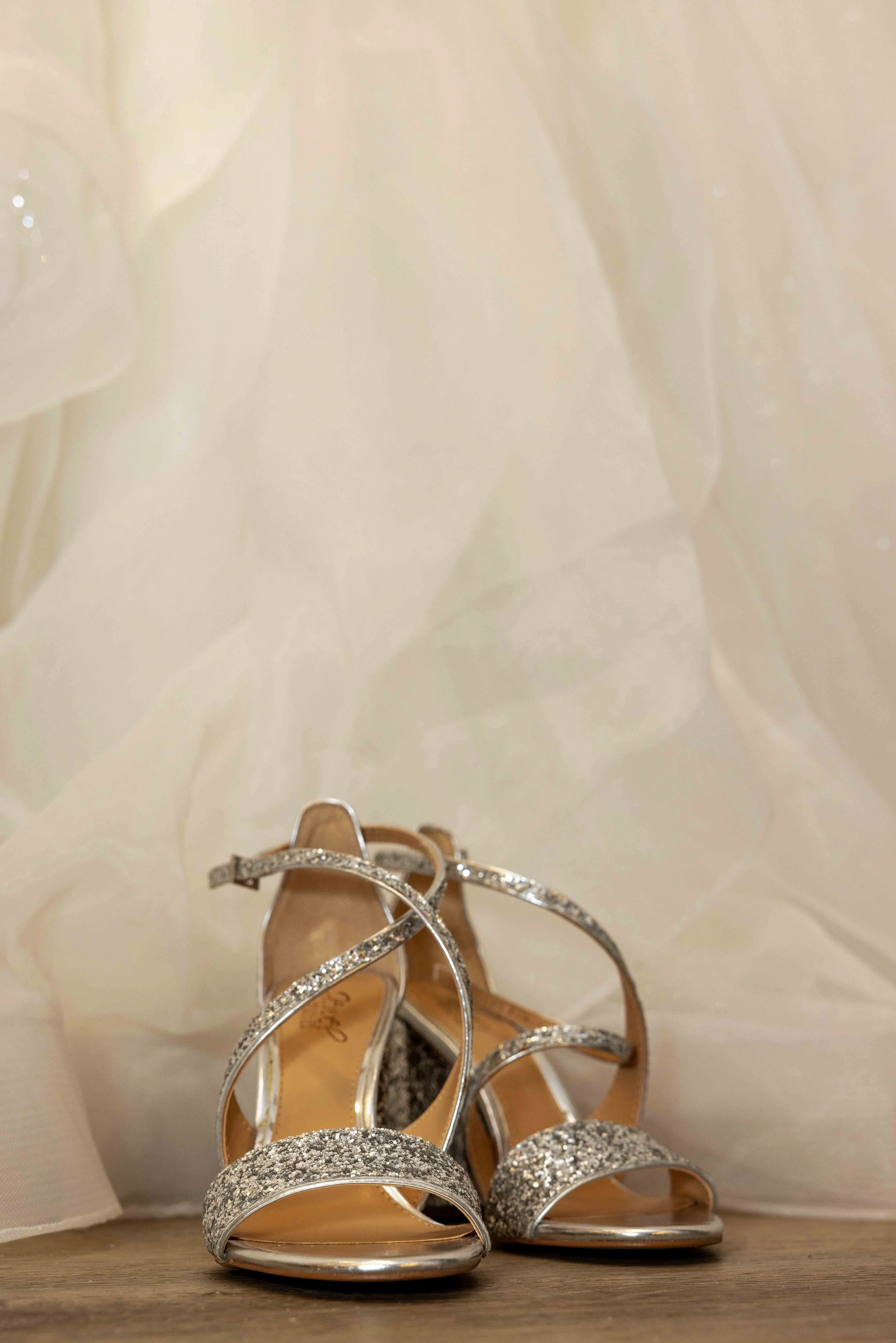 Elegant bridal shoes photographed with wedding details at Walnut Ridge Venue before an Iowa wedding ceremony.