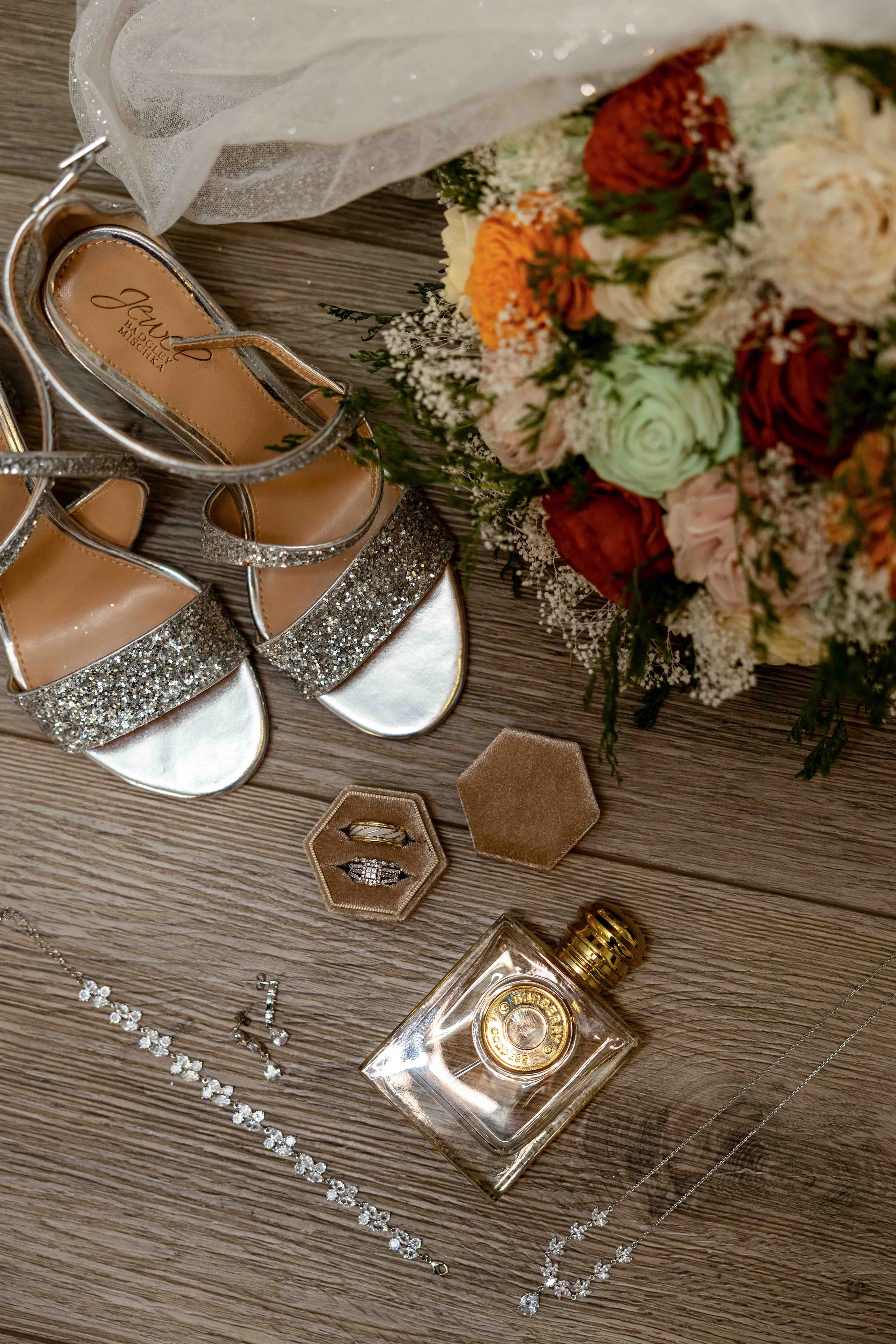 Wedding rings photographed with elegant styling at Walnut Ridge Venue in Iowa before the ceremony.