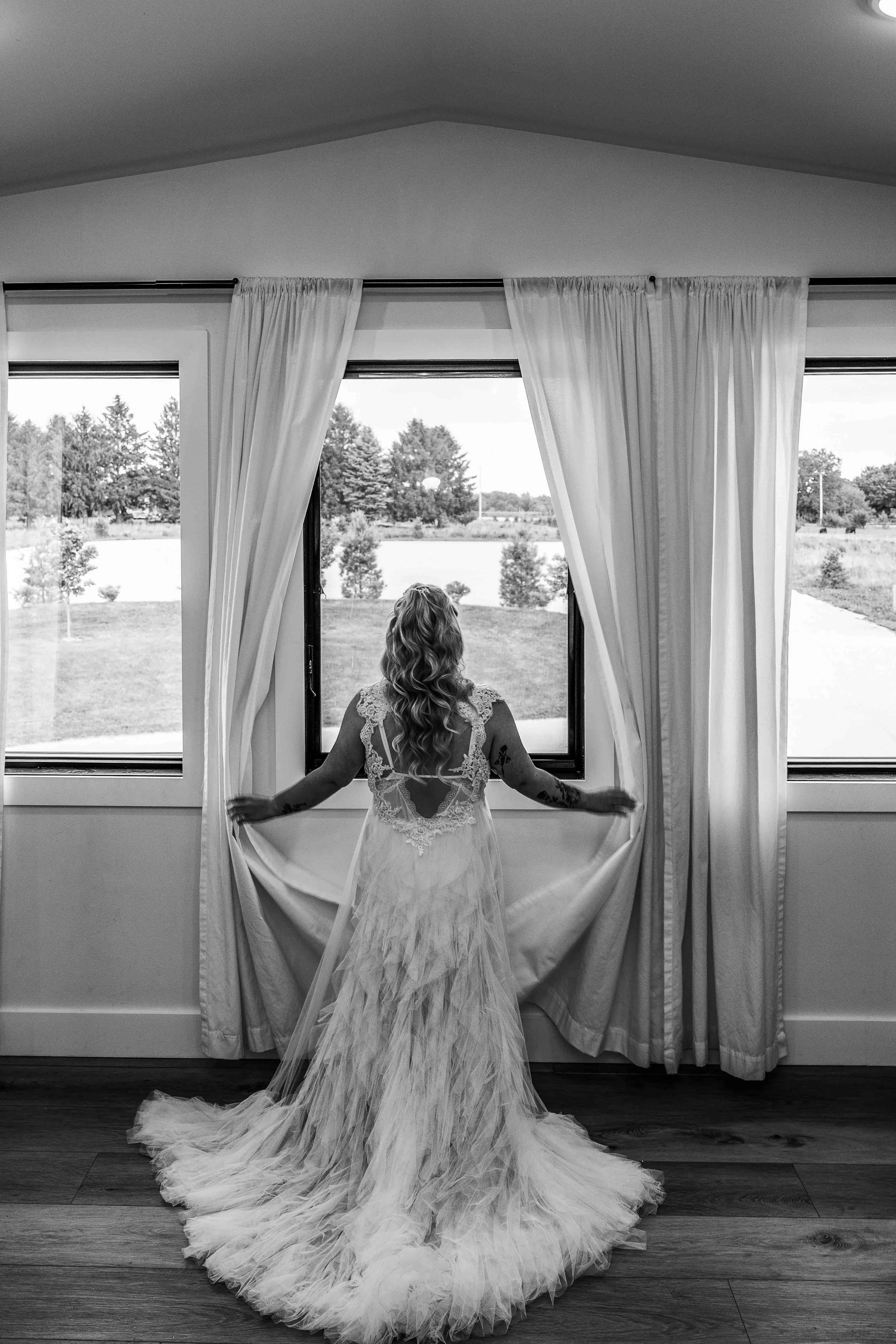 A Quiet Moment with Her EMBODY Bridal Wedding Dress