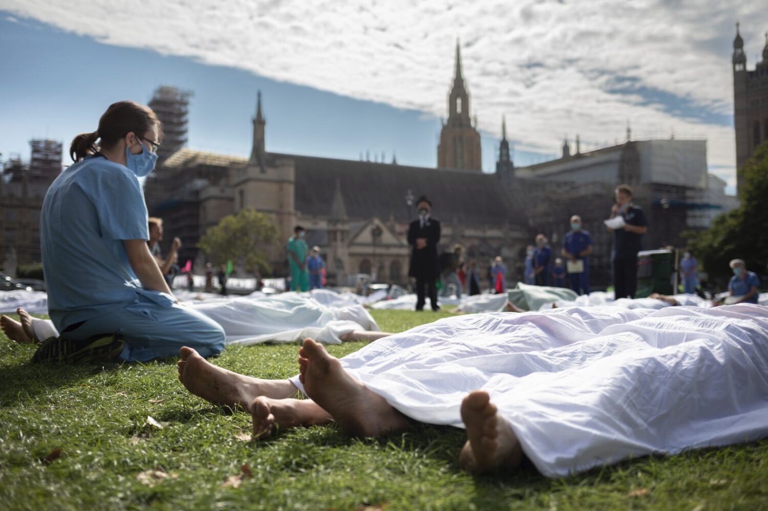 A doctor sits quietly contemplating this potential future, whilst Orthopaedic surgeon Mr Andrew Stevenson - “The coroner” looks on. Photo credit: Crispin Hughes