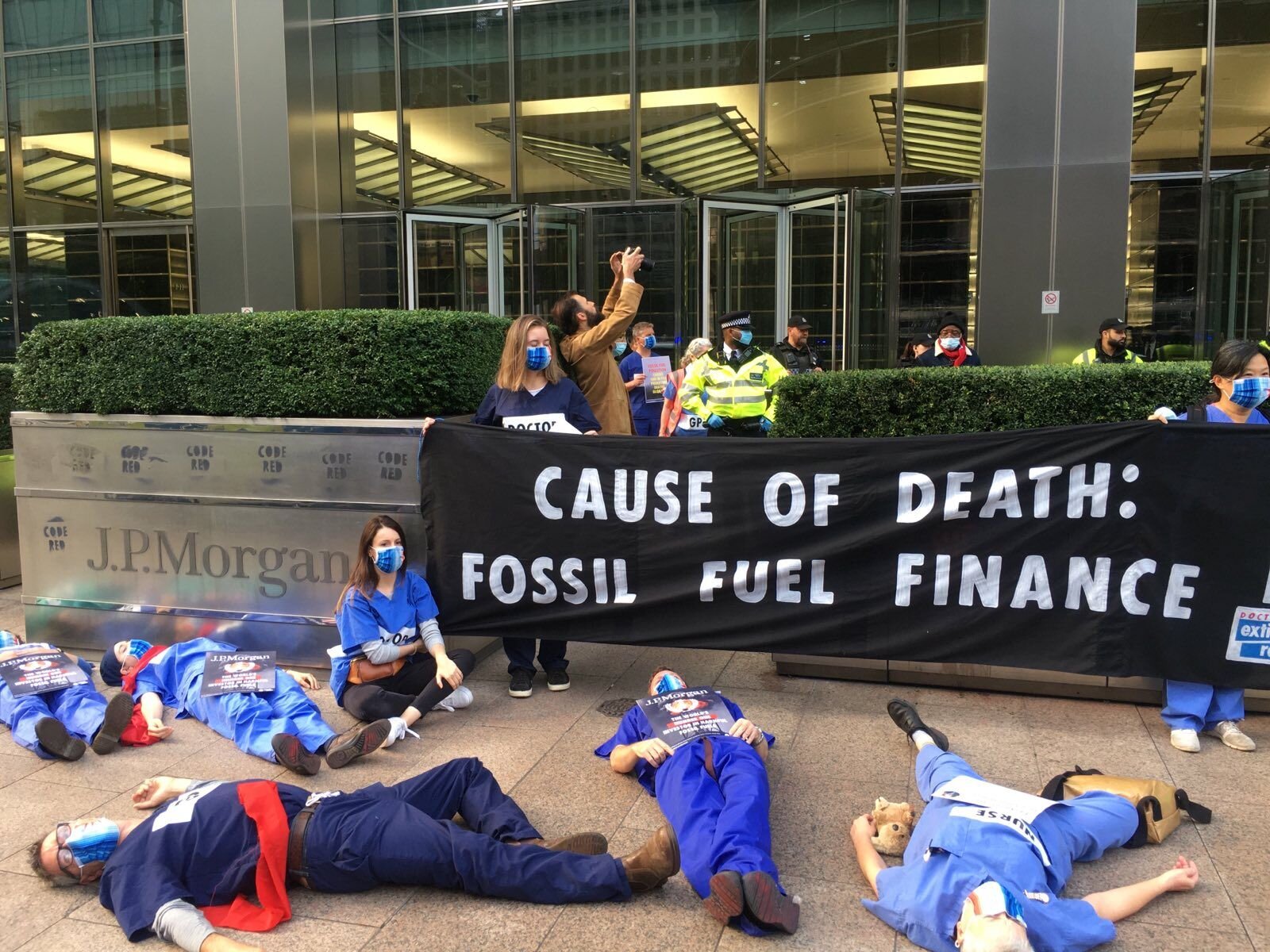 Doctors protest outside JP Morgan offices to demand they end fossil fuel investments