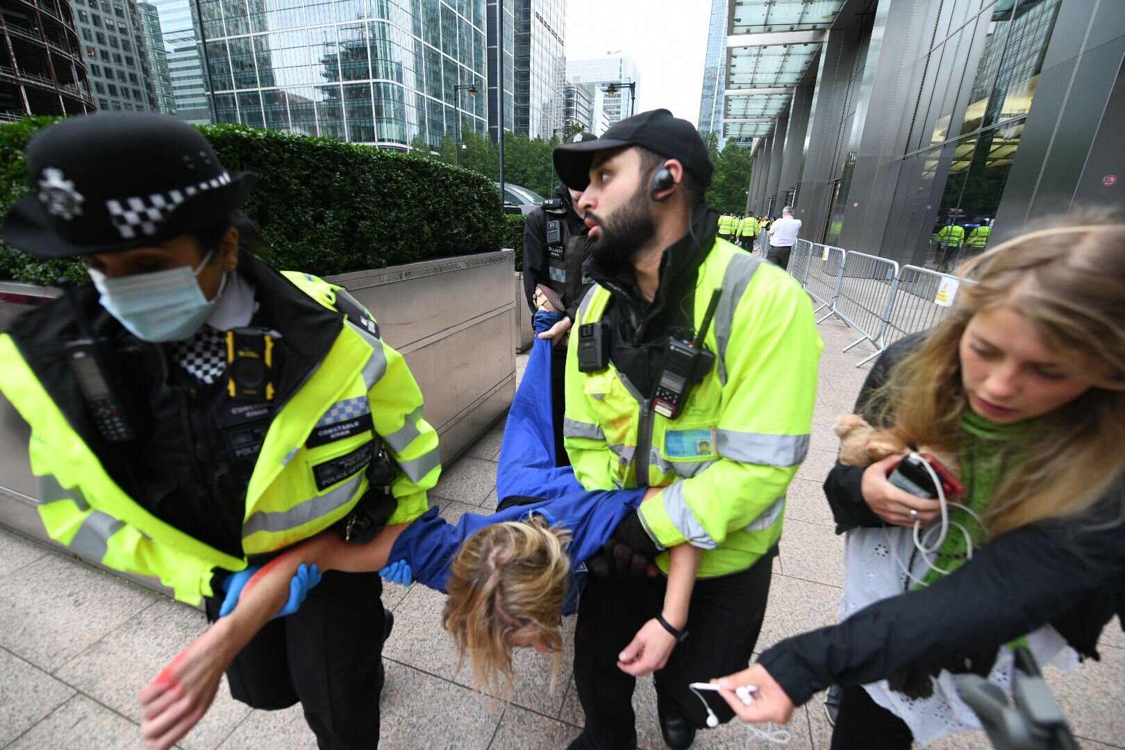 2021-Sep-3-doctor-carried-away-jpmorgan-protest.jpeg