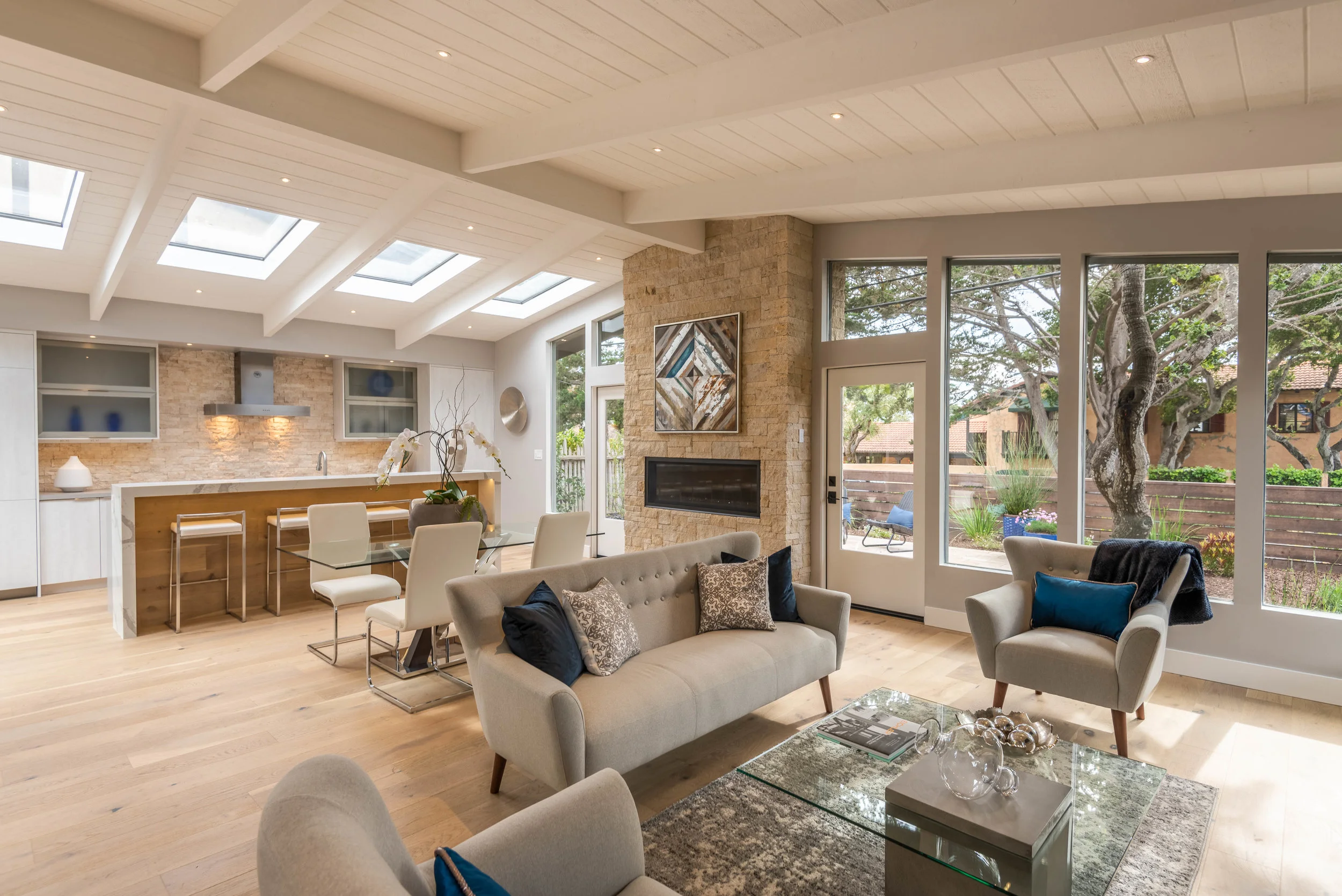John and the team added a hallway, along with a slight bump out to the back that made three bedrooms out of two. Kitchen, living, dinning, and foyer were all opened up with windows and skylights to bring the outdoors in.