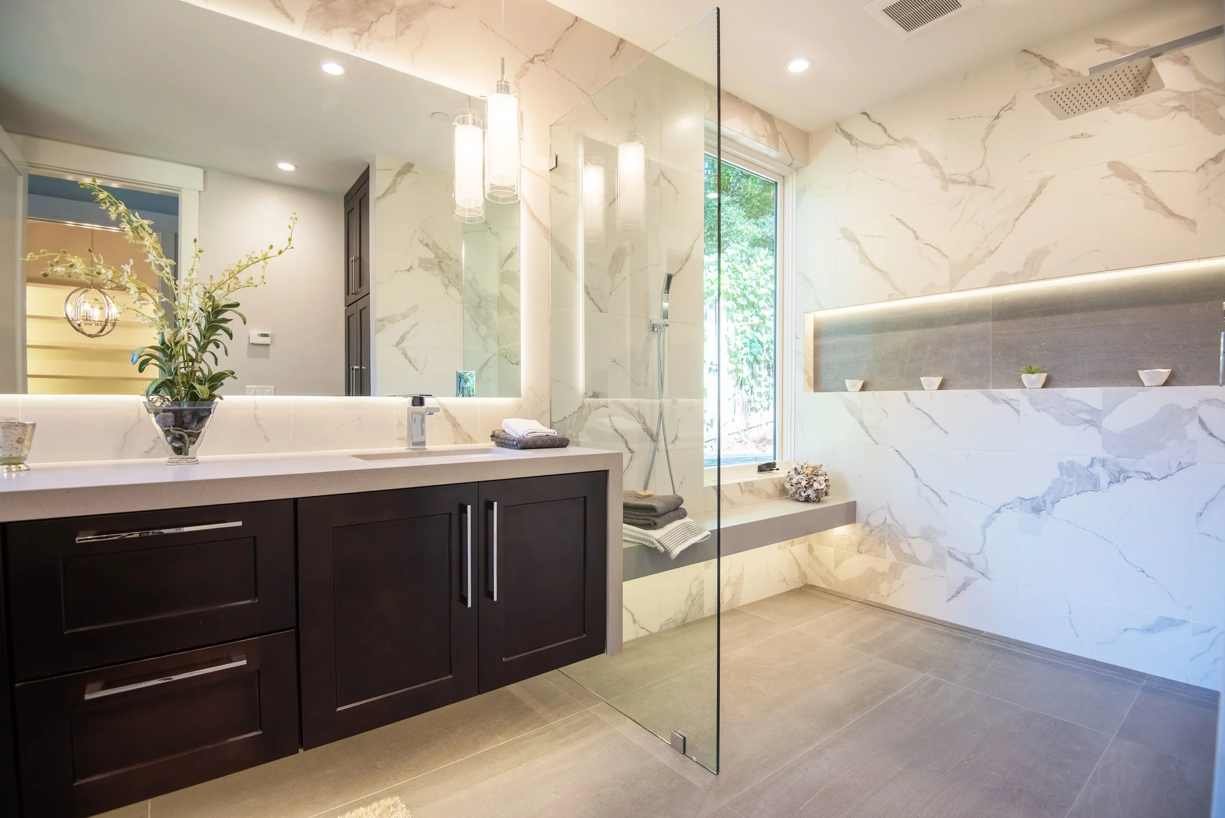 In the Bathroom: Curbless shower, heated bench & hand wand, widened doorways, LED lighting and single lever faucets.