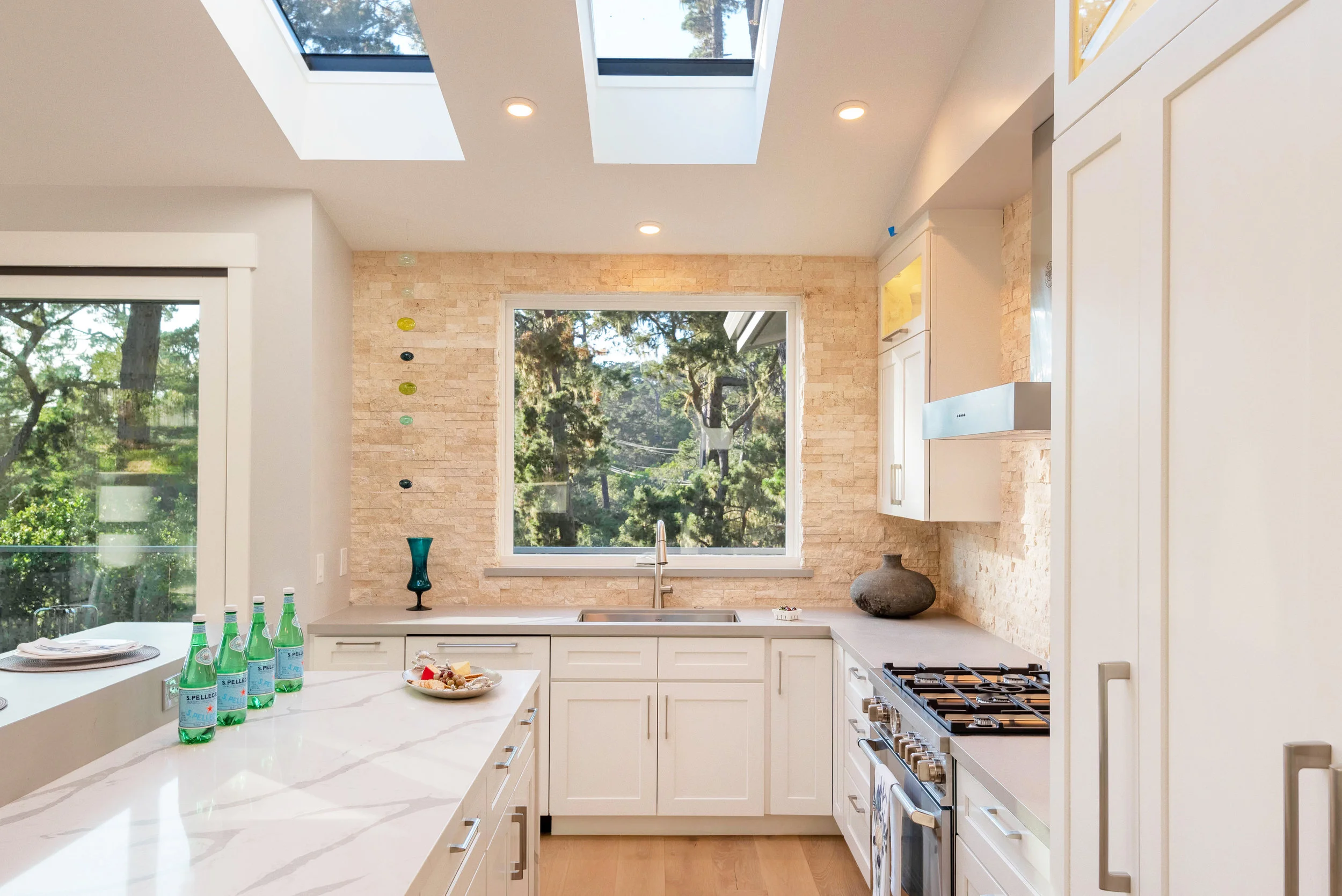 In the Kitchen: Natural light, LED lighting, wide walkways, single lever faucet, and hard surface flooring.