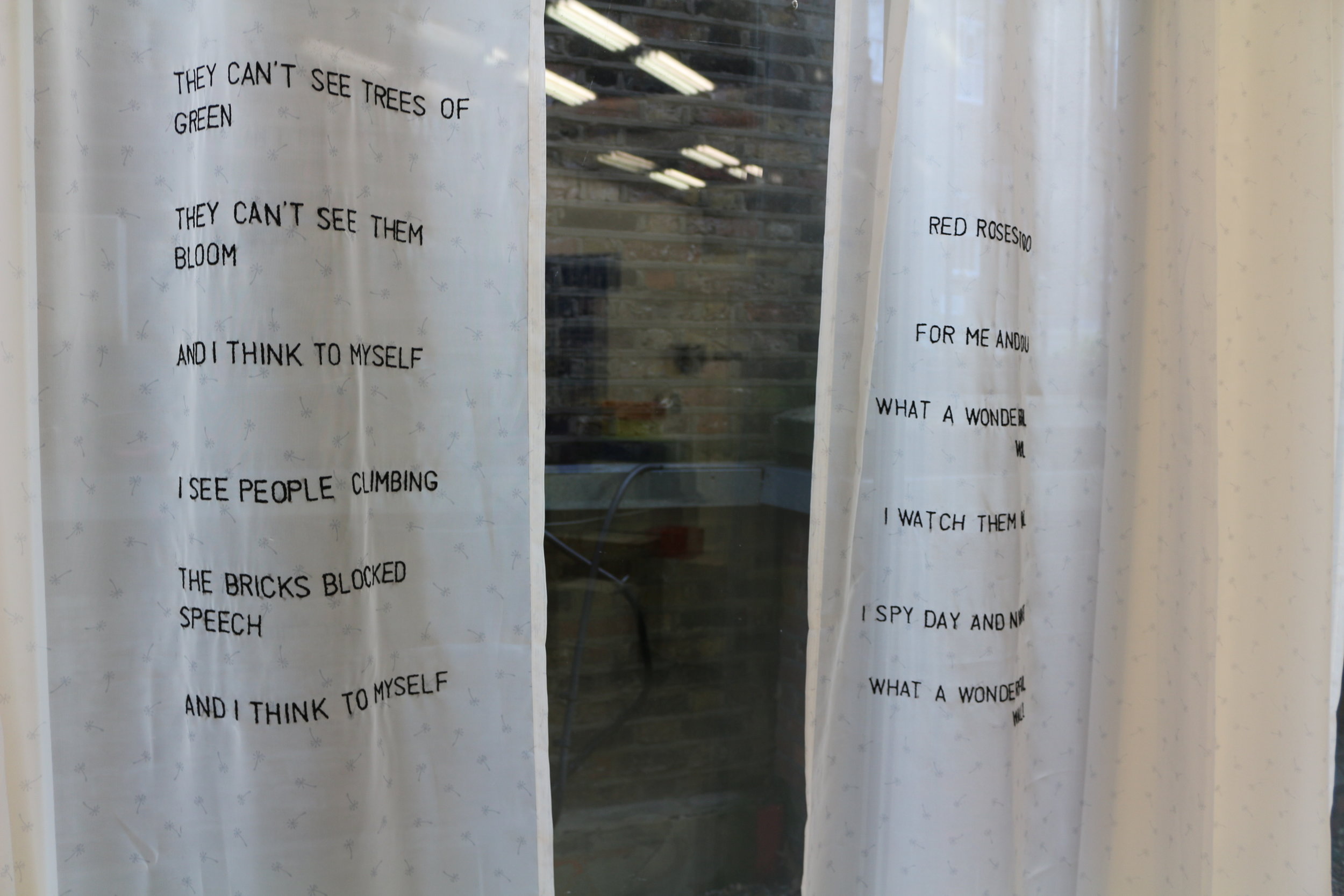   Curtains:   They can’t see trees of green, red roses too  They can’t see them bloom for me and you  And I think to myself what a wonderful wall    I see people climbing, I watch them fail  The bricks blocked speech, I spy days and nights  And I thi