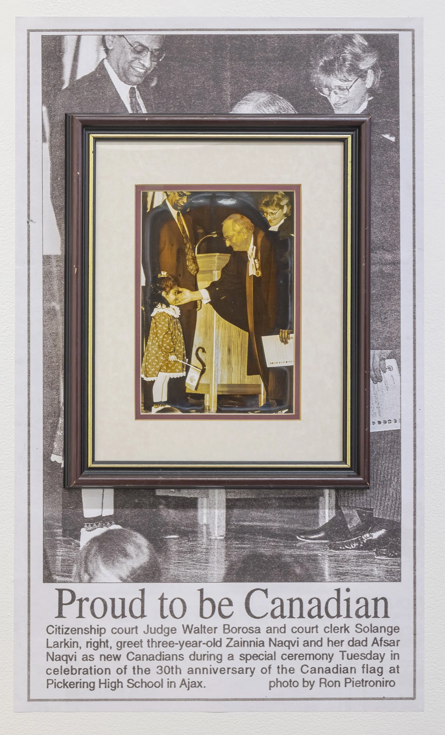  Proud to be Canadian, Featured in Ajax News Advertiser Feb. 19, 1995, 2026 adhesive vinyl, photograph in home frame 30 x 18 in. (76 x 46 cm). Photo by Toni Hafkenscheid 