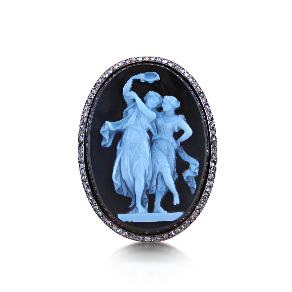 For the eternal romantic, present her with an antique cameo and diamond ring. This agate sardonyx cameo depicts two dancing women, one holding a tambourine to the rose-cut diamond surround. Mounted in 18k pink gold, circa 1880.