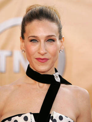    Sarah Jessica Parker, with &nbsp;a diamond clip on her dress collar.   